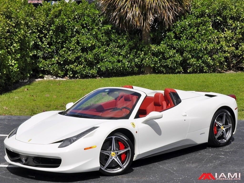 Wallpaper #0HNNiI4BFI5NbQkskCGi9 A Sleek White Ferrari 458 Italia Convertible with a Red Interior