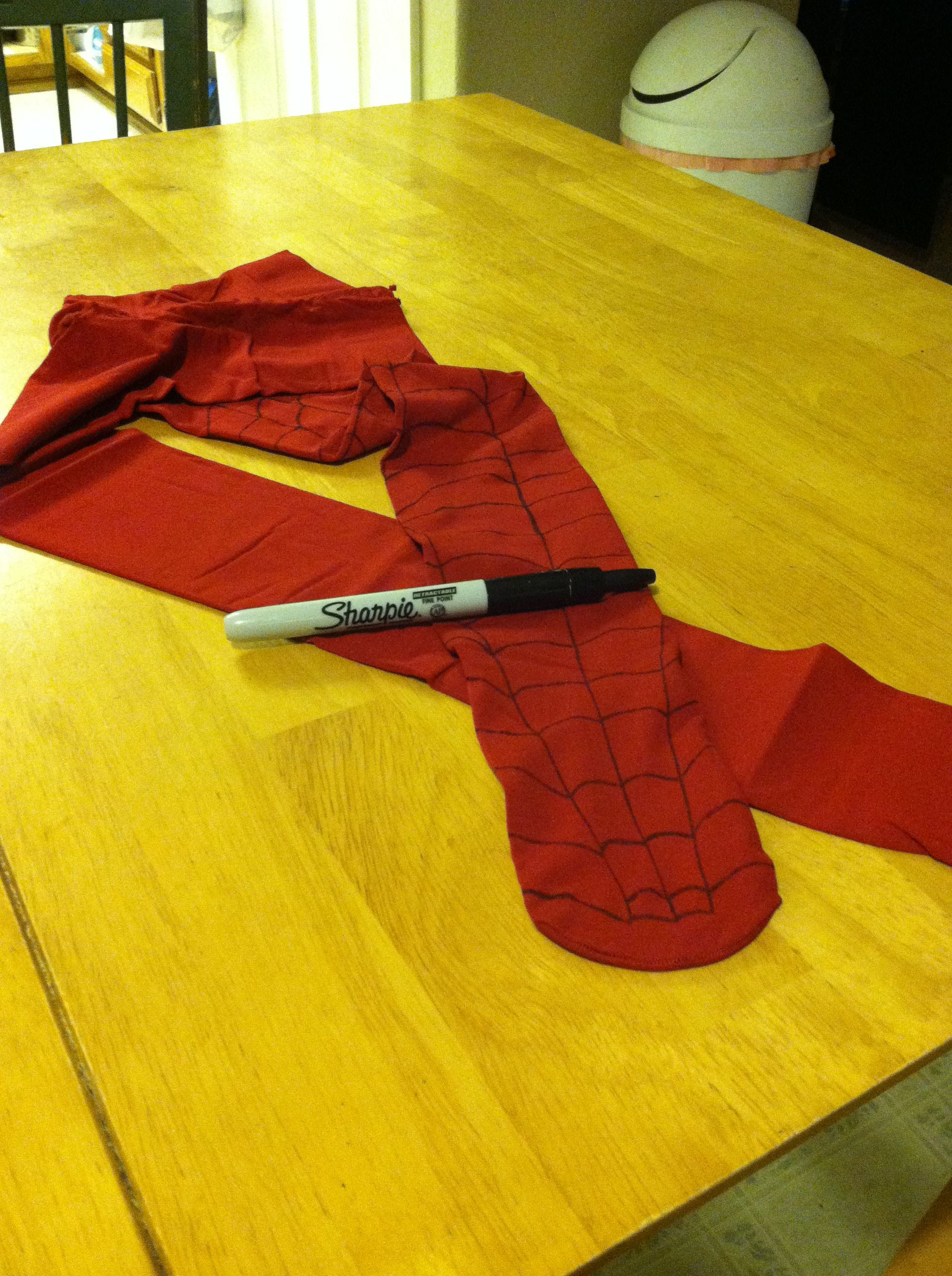 Wallpaper #wmjaIJMBSpphPi3-fy6o87 A Piece of Red Fabric Sitting on Top of a Wooden Table Next to a Marker