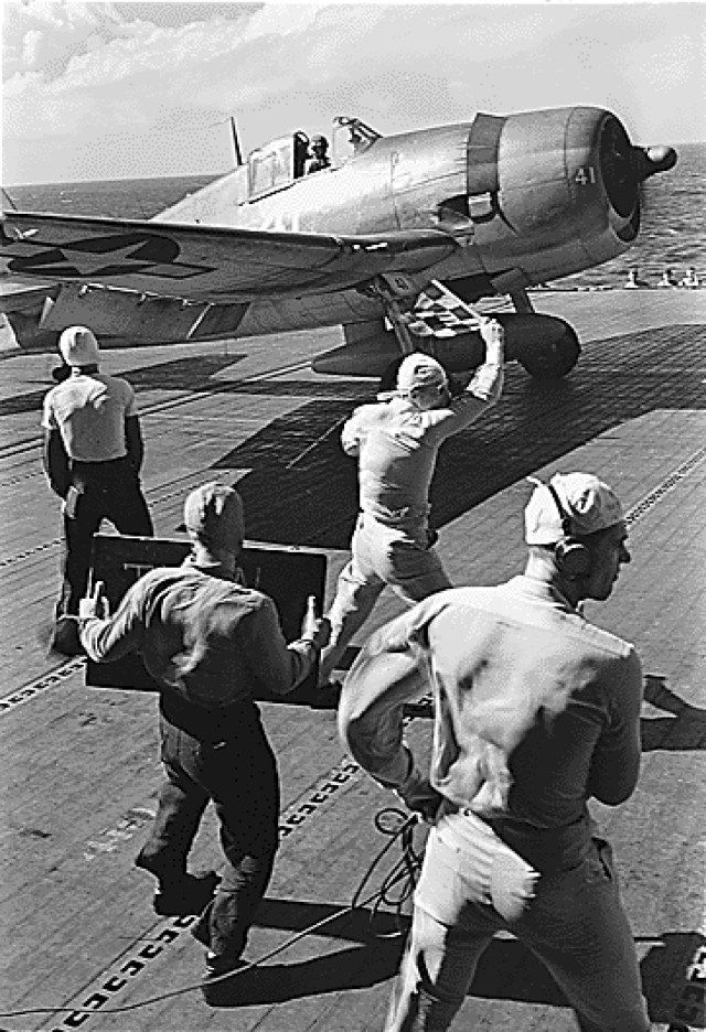 Wallpaper #hrgO15IBJvJKYCmELuEg62 Pilot in an F6f Waits for the Take Off Signal on Board the Uss