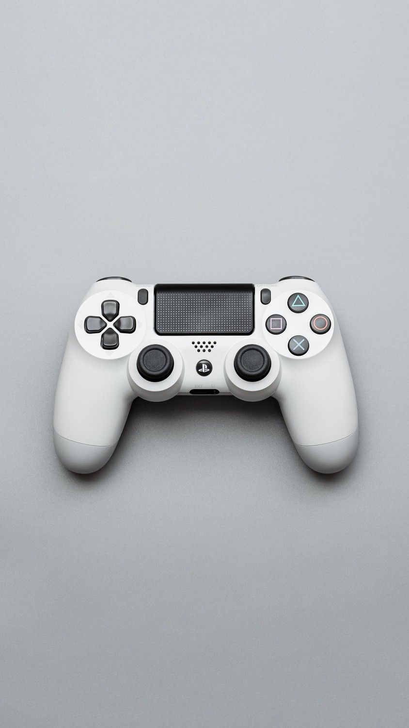 Wallpaper #gbjO3JIBJvJKYCmEZP2A391 Playstation Controller on Gray Surface