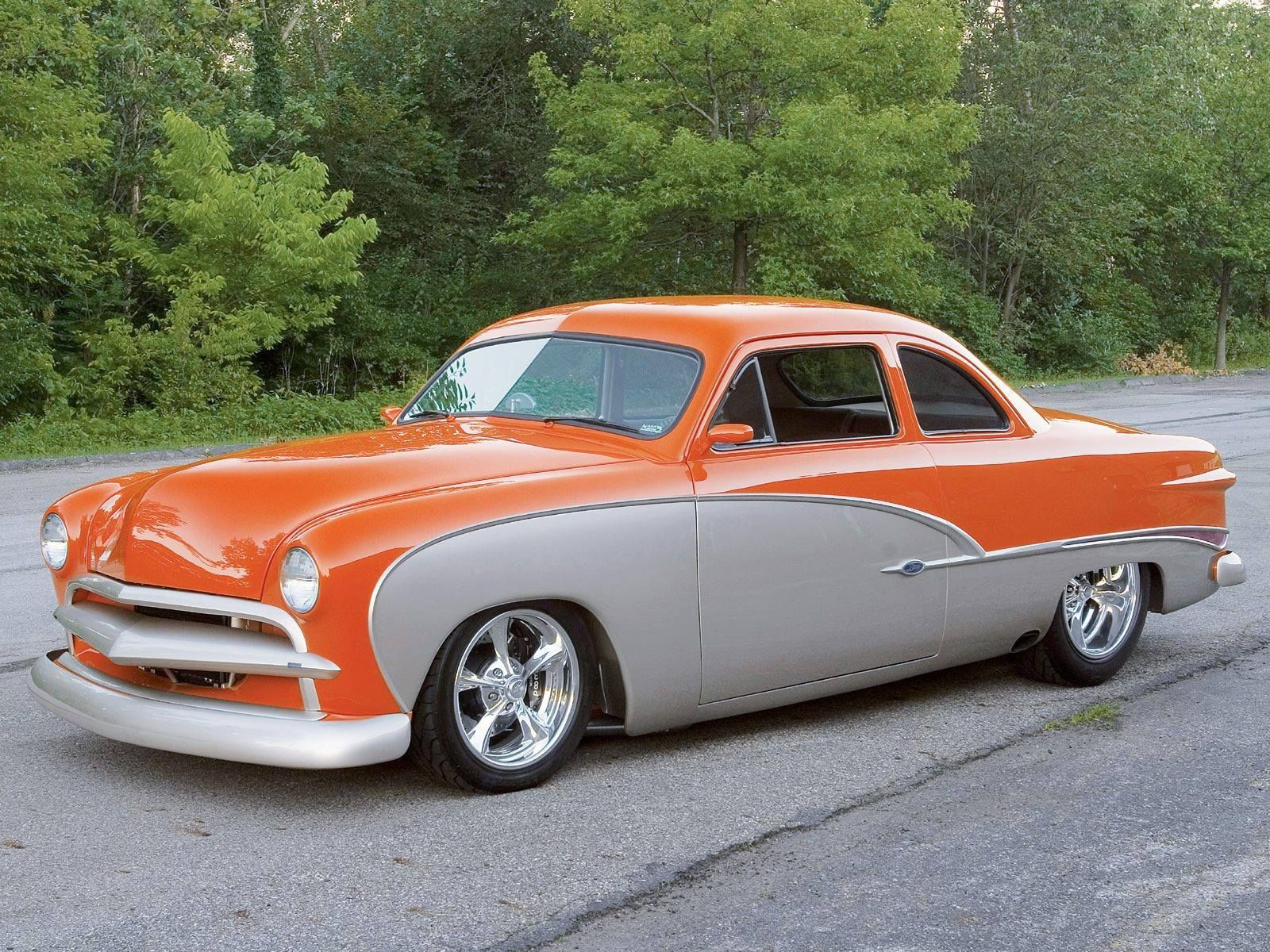 Wallpaper #CUV-jo4B7YBJg1BVkJ2n34 A Classic 1950s Ford in Bright Orange and White