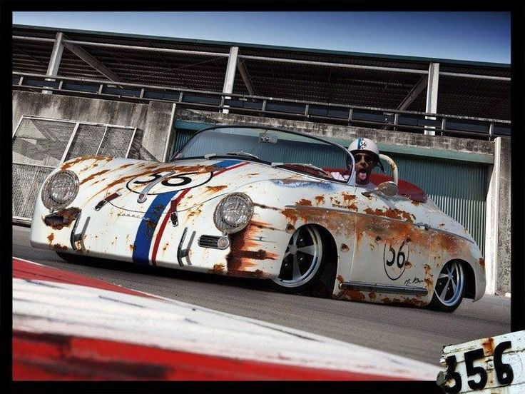 Wallpaper #Bbia1pIBJvJKYCmE39-L267 An Old Rusty Sports Car is Parked in Front of a Building with Graffiti