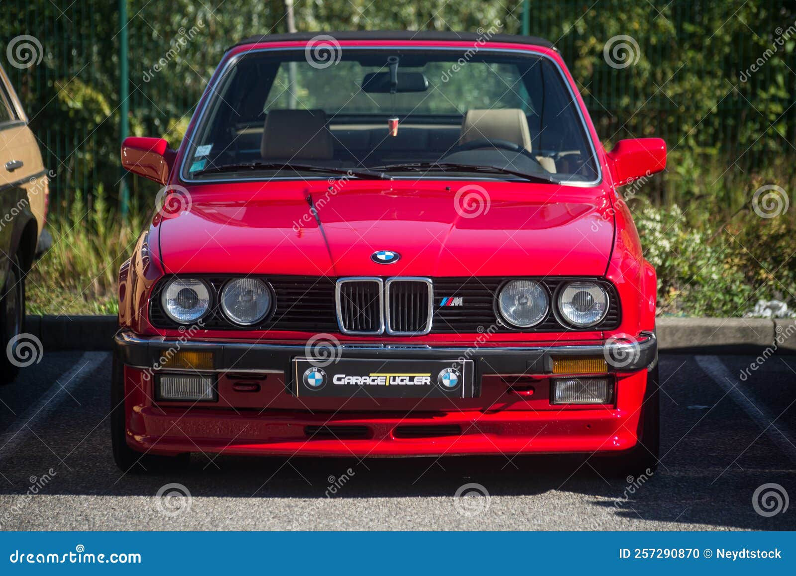 Wallpaper #D2d265IBSpphPi3-DEz1138 Front View of Red BMW M3 Vintage Car Parked in the Street Editorial