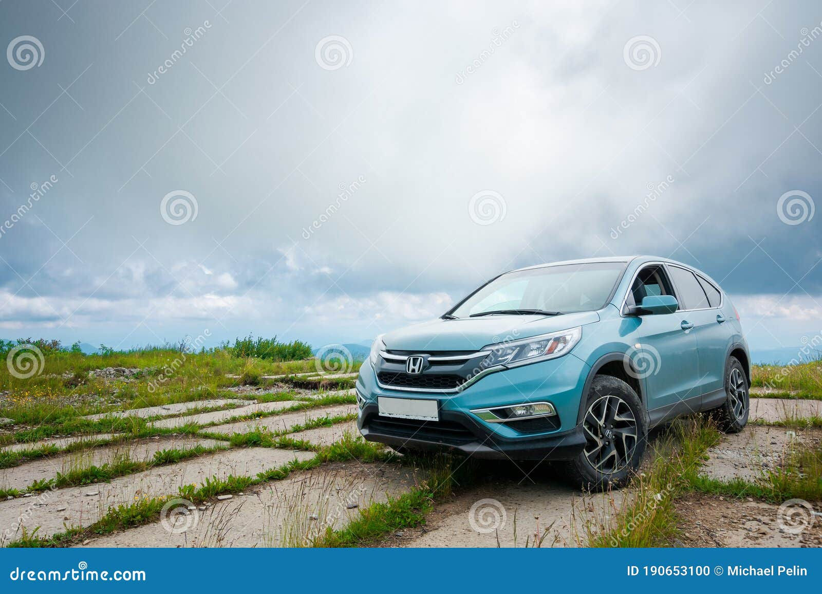Wallpaper #-mcH75IBSpphPi3-RV-L81 Honda Cr V SUV on a Concrete Pavement Editorial Image Image of Grass