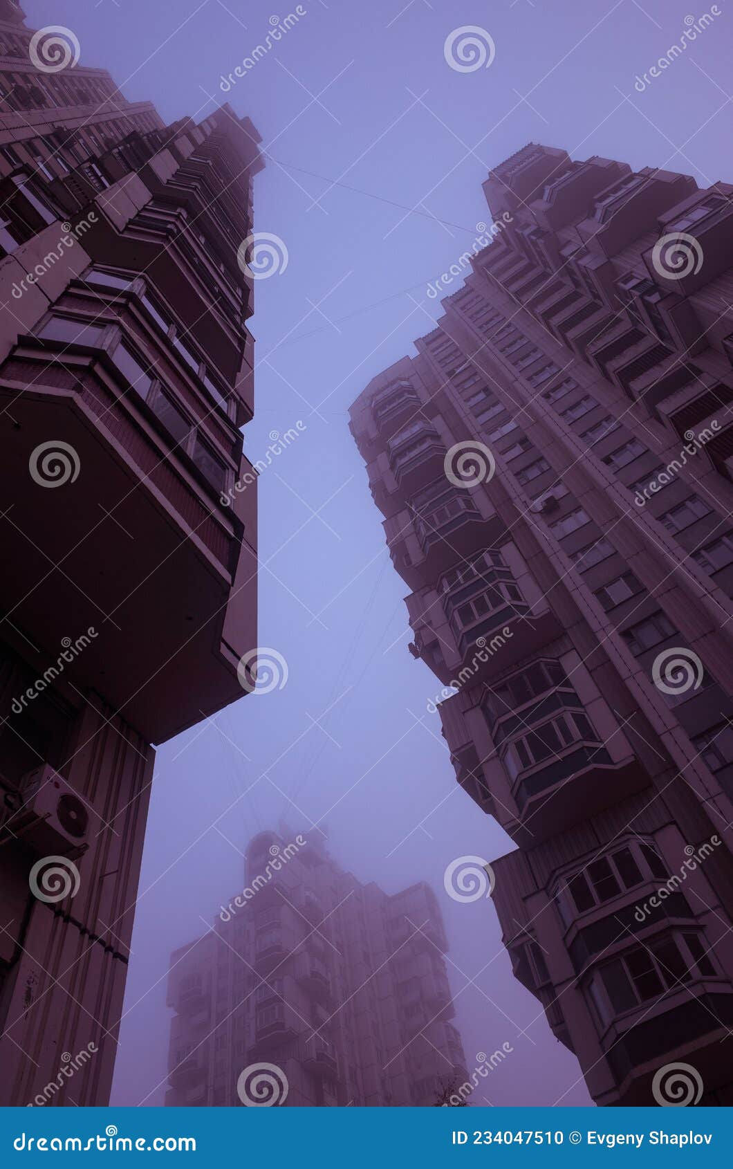Wallpaper #WP9dapMB3lSXT3zUJuY38 Three Tall Residential Buildings Immersed in Misty Violet Sky