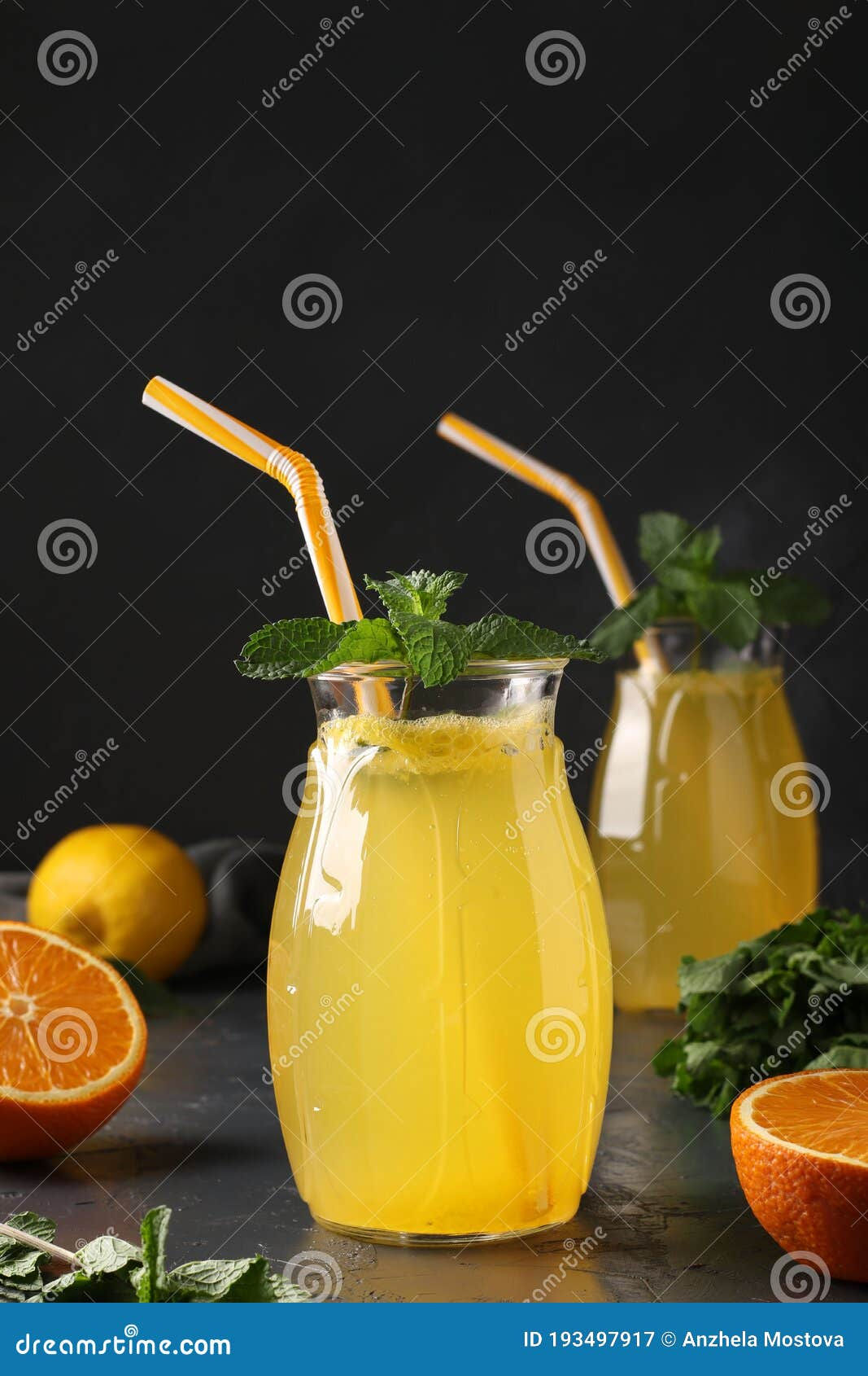 Wallpaper #GGfpAZMBSpphPi3-Wa1b159 Homemade Lemonade of Lemons and Oranges Decorated with Mint in Tall