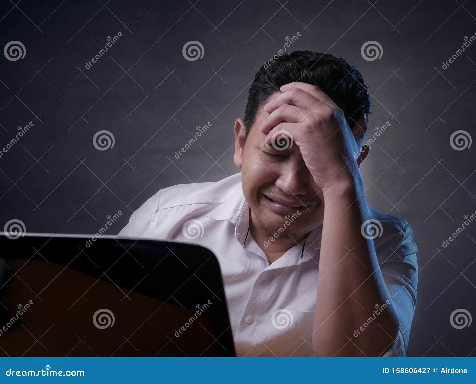 Wallpaper #q2eP65IBSpphPi3-00yX185 Upset Man Crying When Looking at Laptop Stock Image Image of
