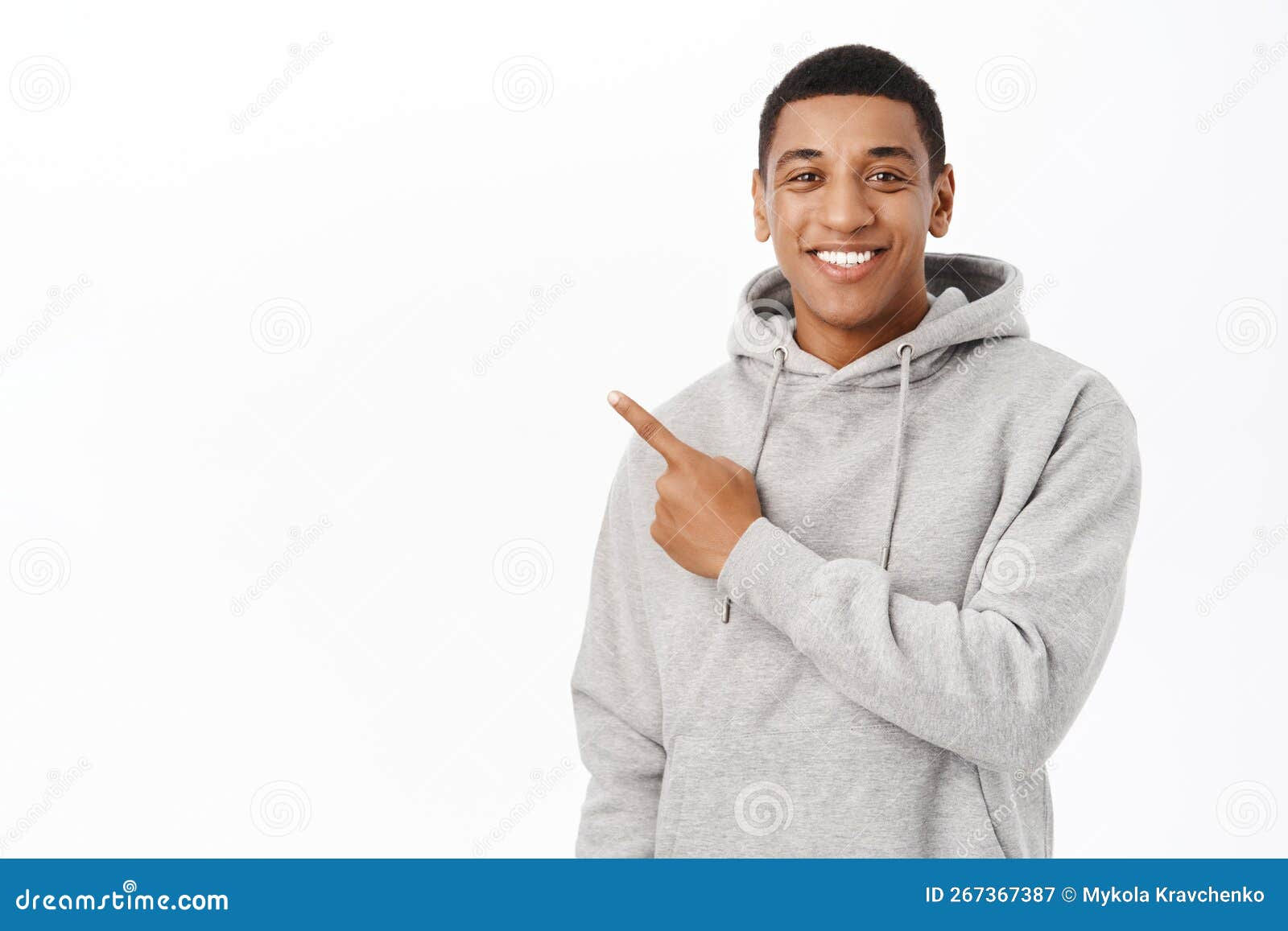 Wallpaper #IWf6_JIBSpphPi3-lZoB167 Portrait of Smiling African American Man Pointing Finger Left at Banner