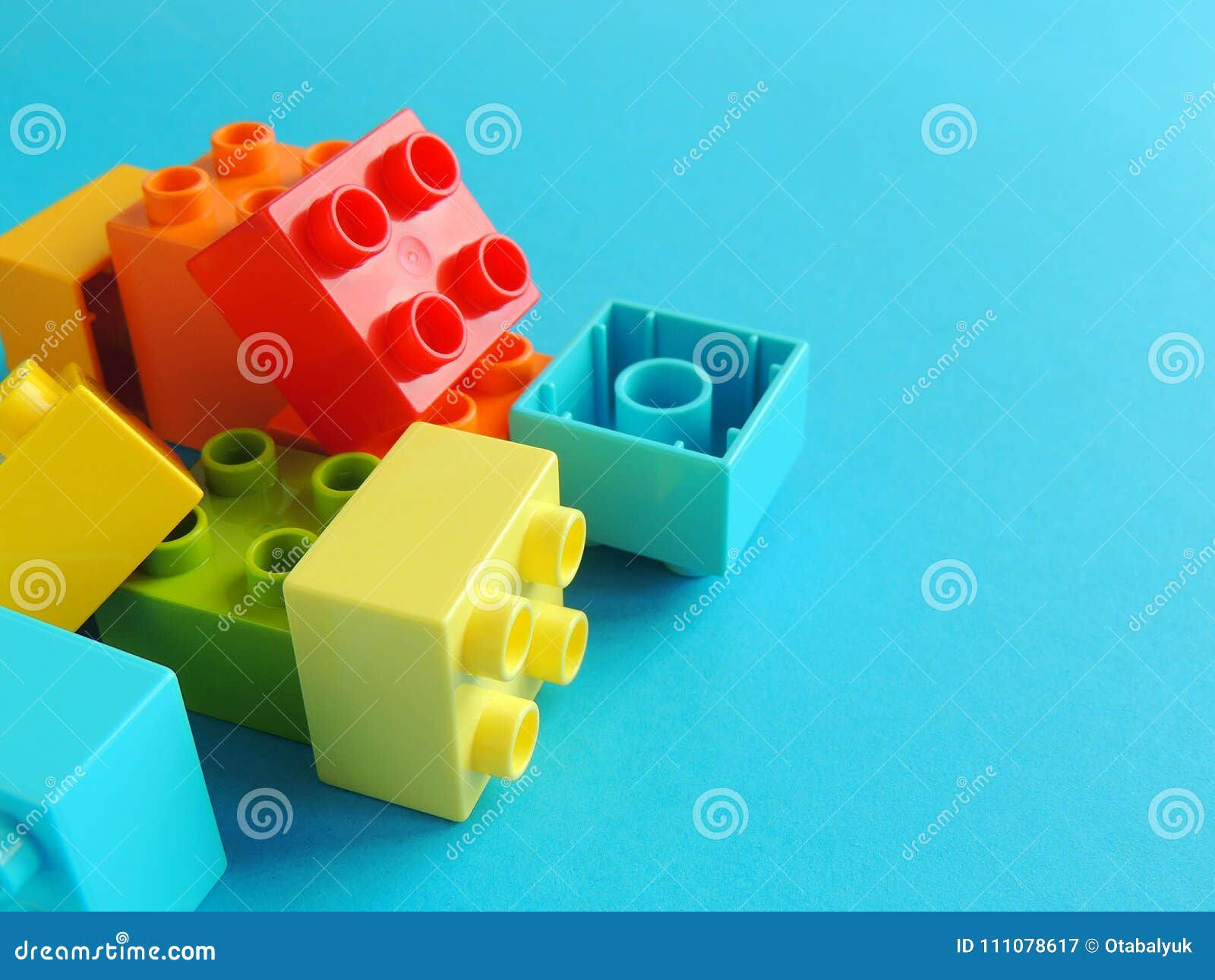 Wallpaper #HgPtYpMBpyOg8YnEB9Sq326 Plastic Bricks Blocks Toy on Bright Blue Background Stock Image