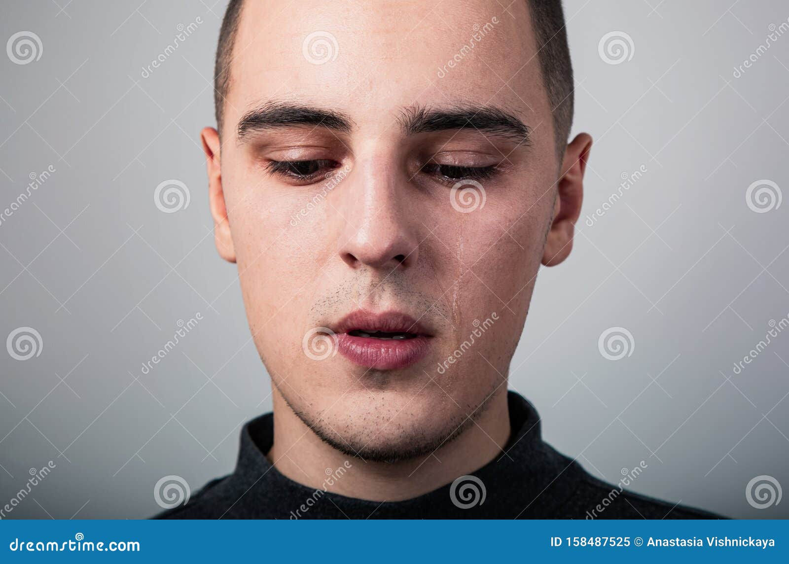 Wallpaper #q2eP65IBSpphPi3-00yX262 Unhappy Crying Young Man with Dropping Tears on the Face Closeup