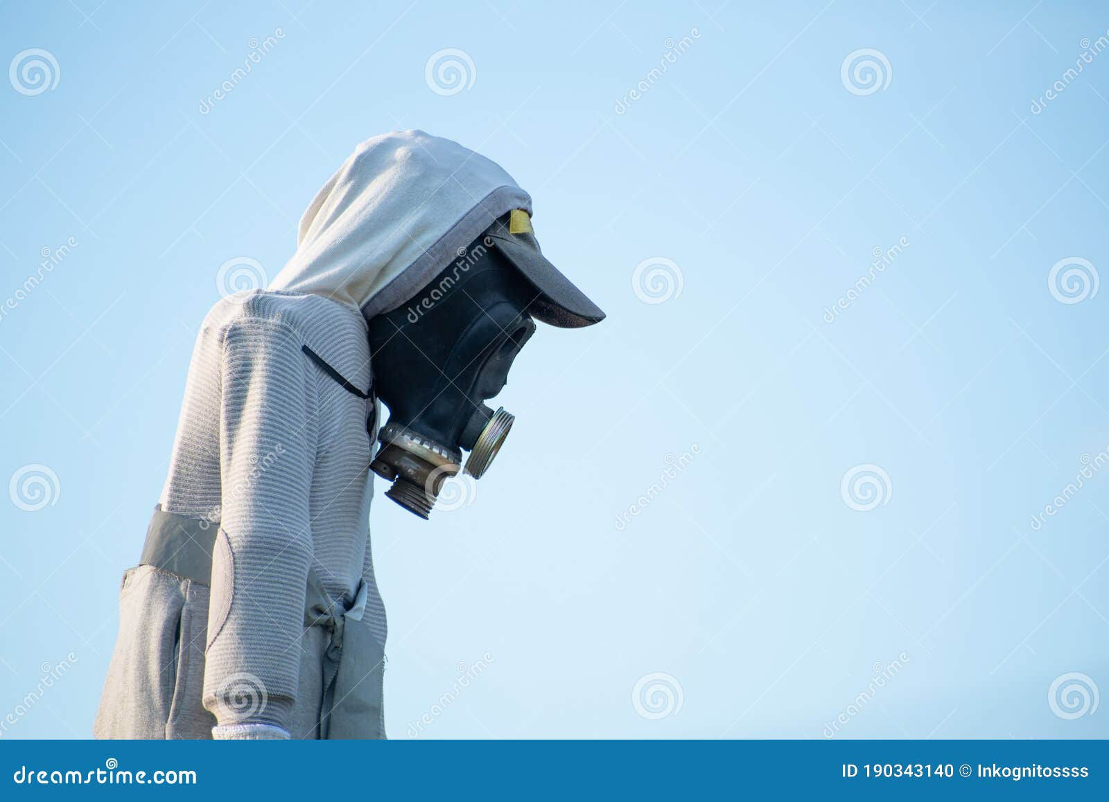 Wallpaper #p_DMfJcBi4JM6agGyB5B128 Scarecrow with Gas Mask Against Blue Sky Stock Photo Image of Ecology