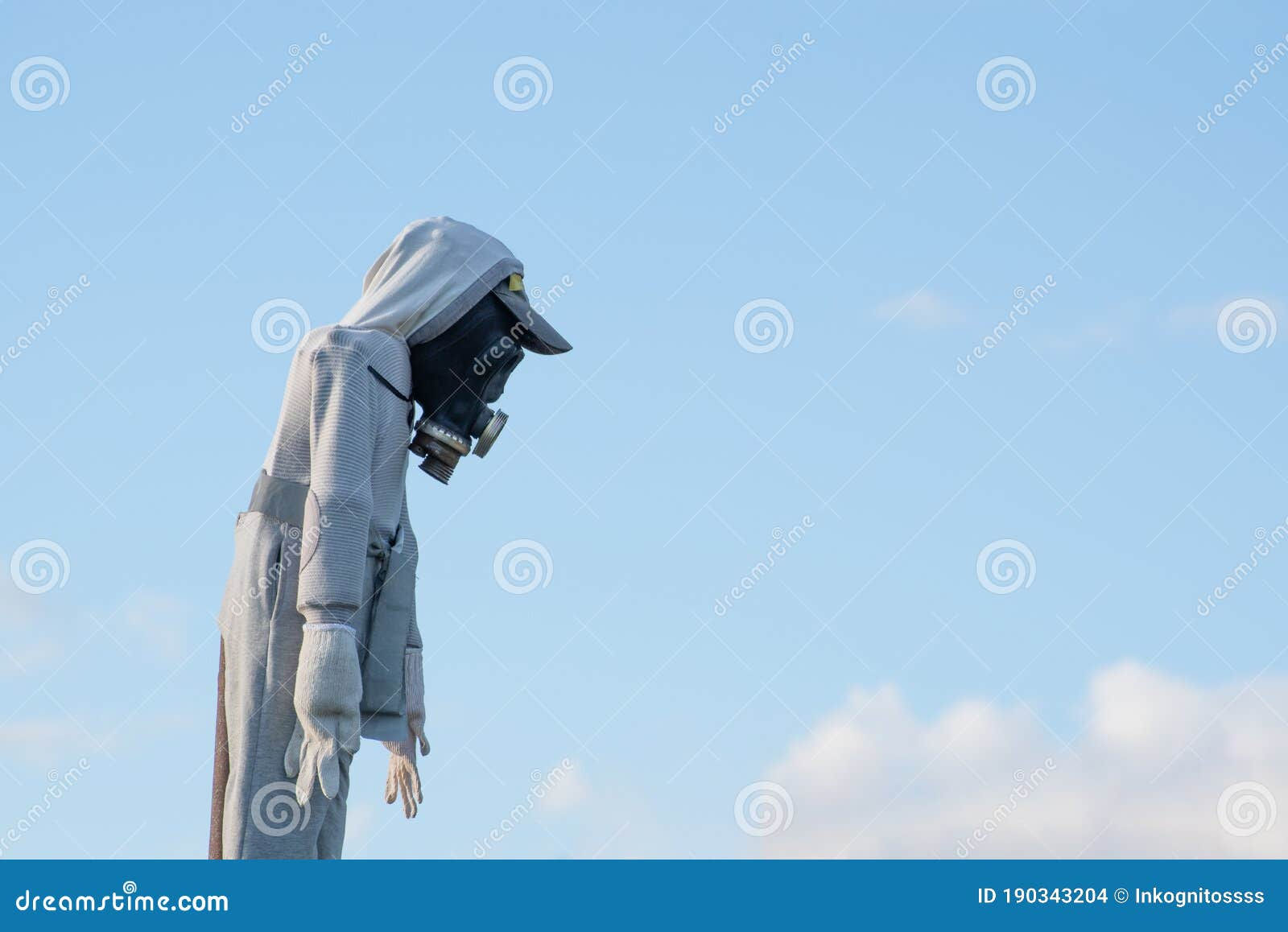 Wallpaper #p_DMfJcBi4JM6agGyB5B82 Scarecrow with Gas Mask Against Blue Sky Stock Photo Image of