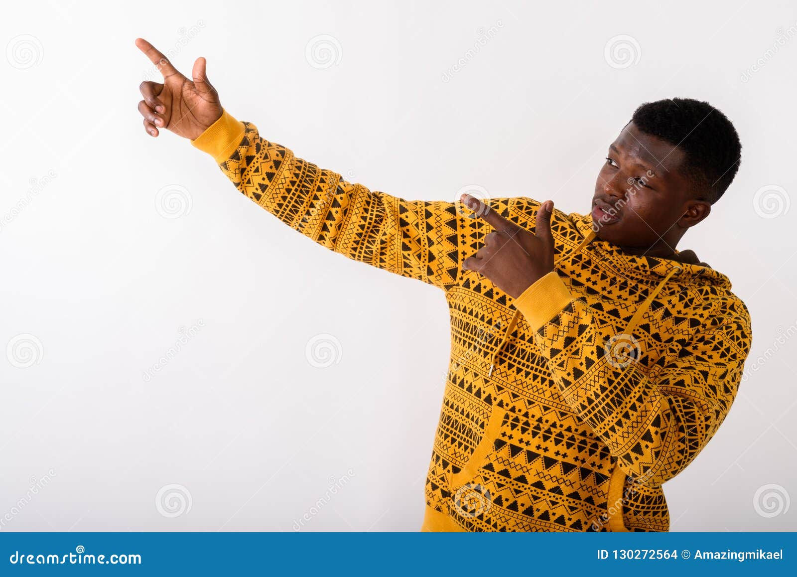 Wallpaper #IWf6_JIBSpphPi3-lZoB217 Studio Shot of Young Black African Man Pointing Both Fingers Up Stock