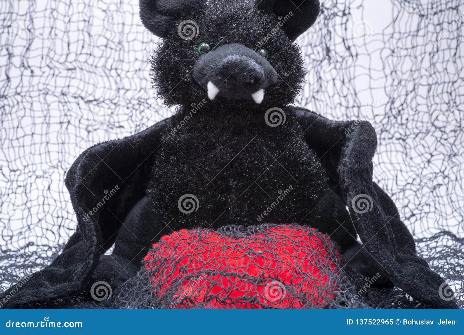 Wallpaper #hmeI95IBSpphPi3-uIae346 Stuffed Funny Black Bat Toy with Red Fluffy Heart on Creepy Cotton Web