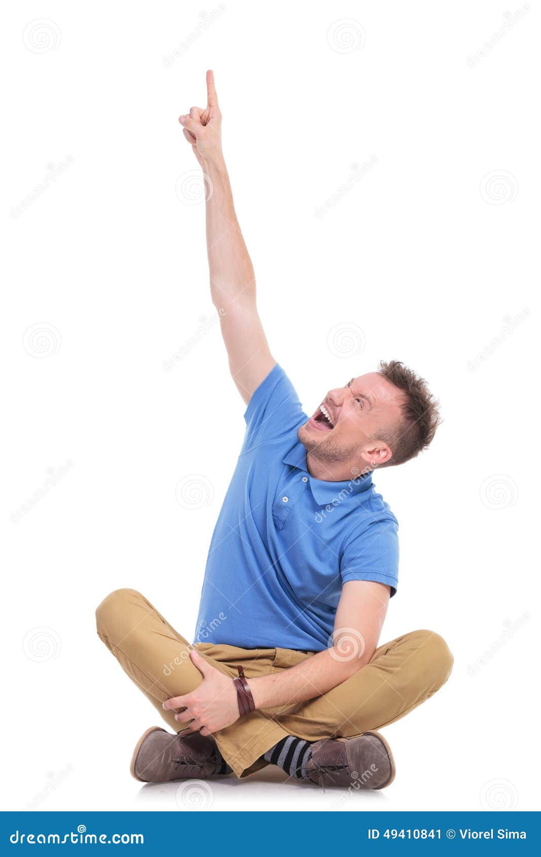 Wallpaper #q5y34JIBZHQxiYarwLdA38 Seated Young Casual Man Pointing Above Him Stock Image Image of Jeans