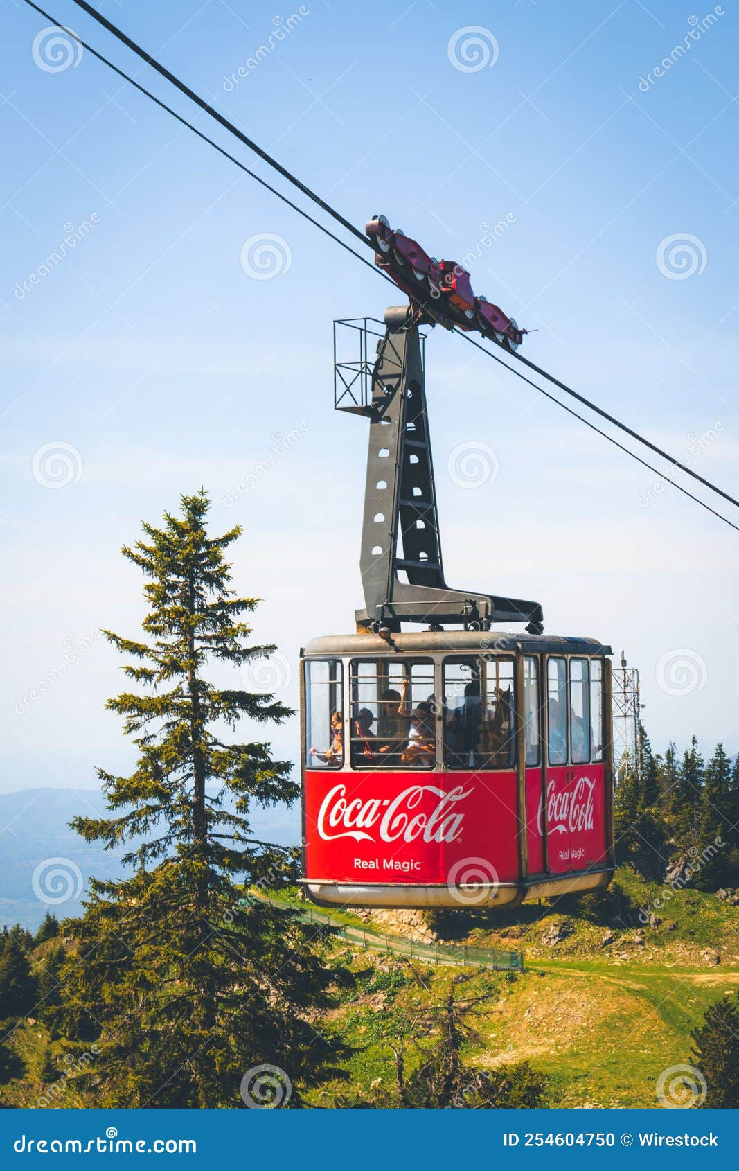 Wallpaper #1jVpkpcBk_lpvpalRJR8165 Group of People Inside a Cable Car with Coca Cola Print on It Editorial