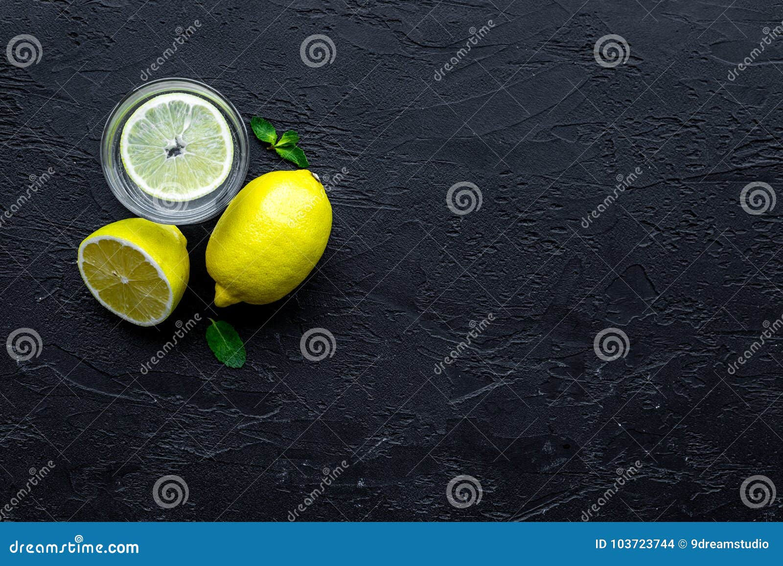 Wallpaper #4WcM6pIBSpphPi3-bkQ1245 Glass of Homemade Lemonade on Black Background Top View Copyspace Stock