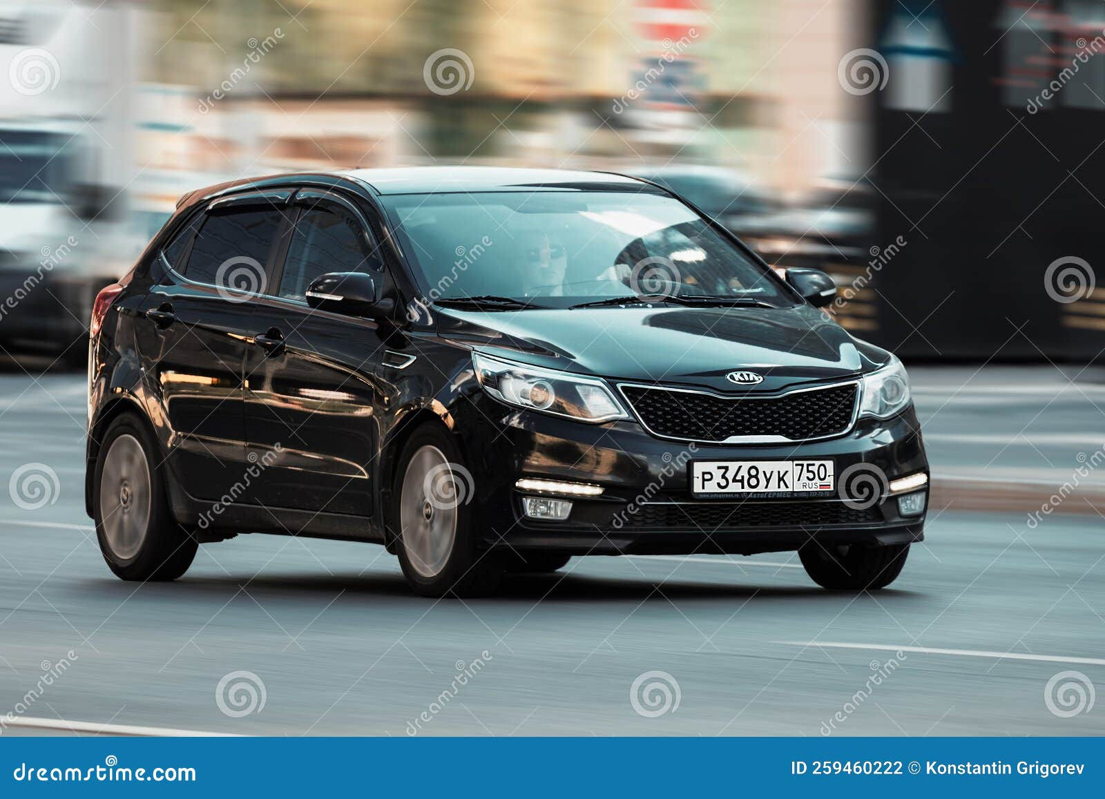 Wallpaper #kWidIpMBSpphPi3-uDN449 Front Side View of Black Car Kia Rio Third Generation Fast Moving Kia