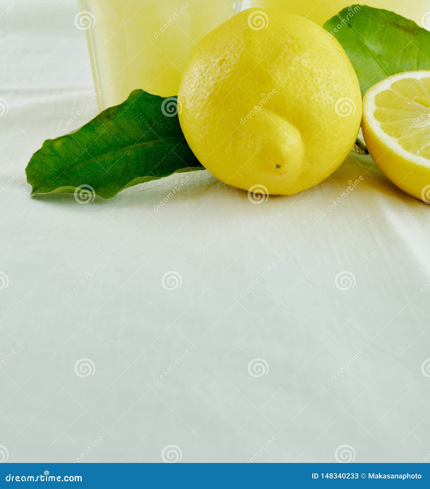 Wallpaper #GGfpAZMBSpphPi3-Wa1b150 Fresh Organic Lemonade in a Jar with Lemons and Leaves and a Glass of