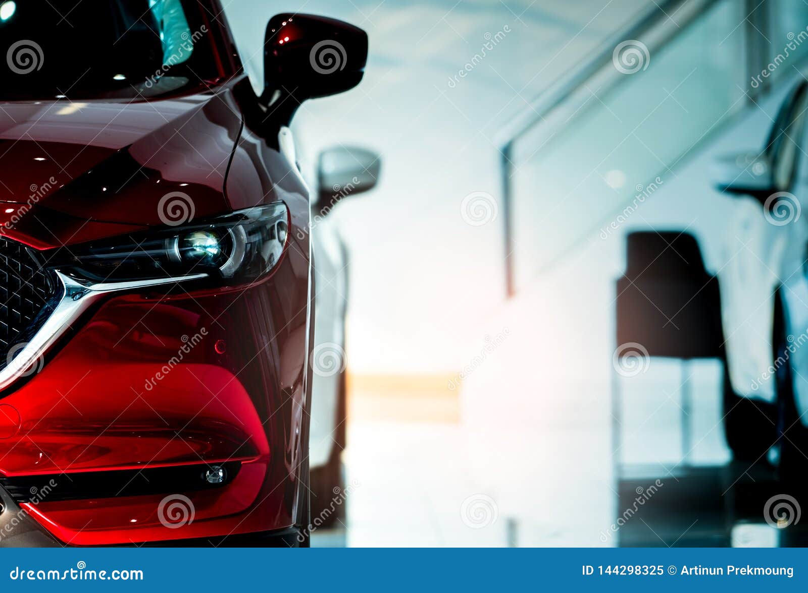 Wallpaper #uGgdF5MBSpphPi3-ng1U179 Front View of Red Car New Luxury Compact Car Parked in Modern Showroom