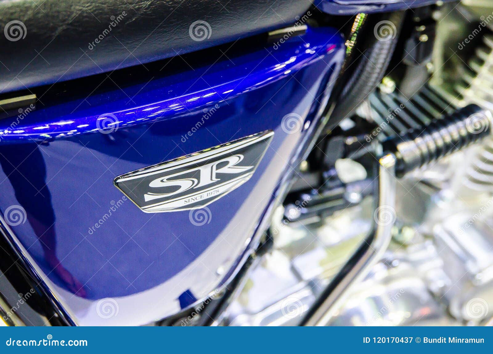 Wallpaper #qmd-DJMBSpphPi3-ad6B22 Logo of New Model Classic Kawasaki Sr in Dark Blue at Bangkok Motorshow
