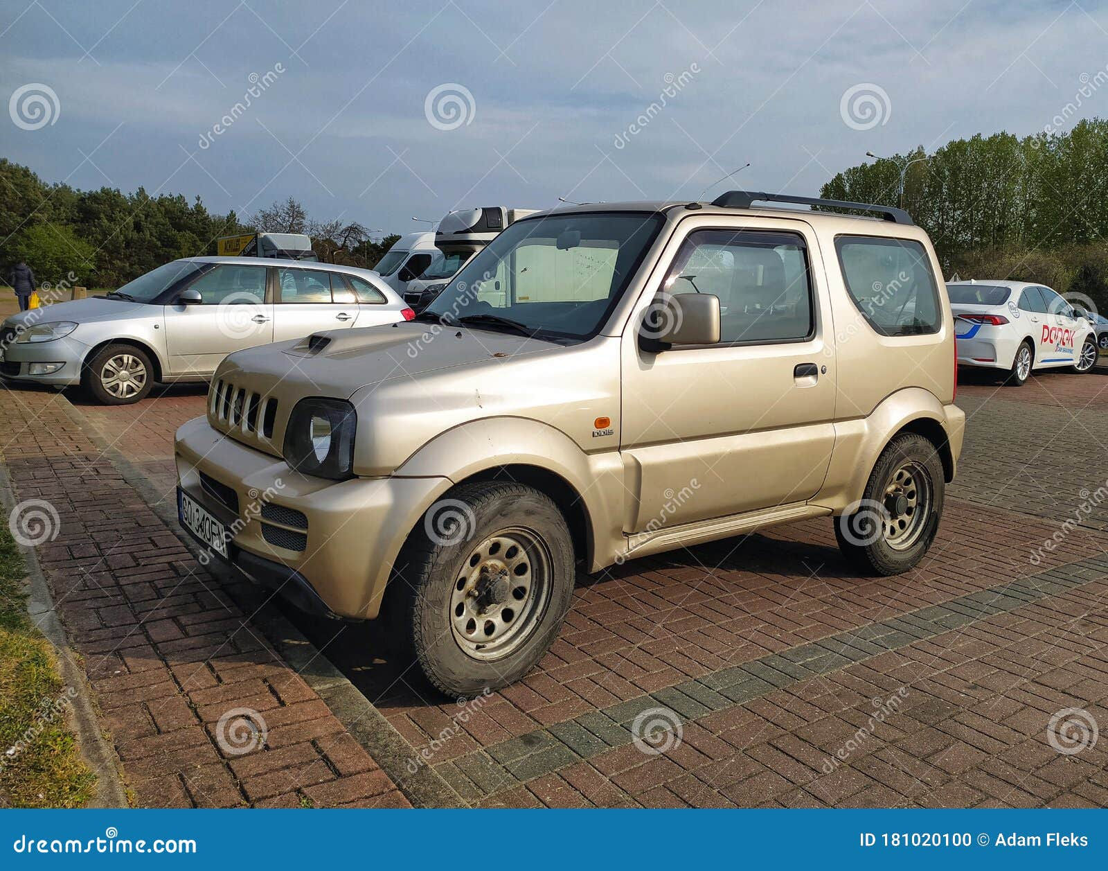 Wallpaper #JRltLI8BtGB6xQ78EZD452 Old Grey Silver Suzuki Jimny 4wd Car with Two Doors Parked Editorial