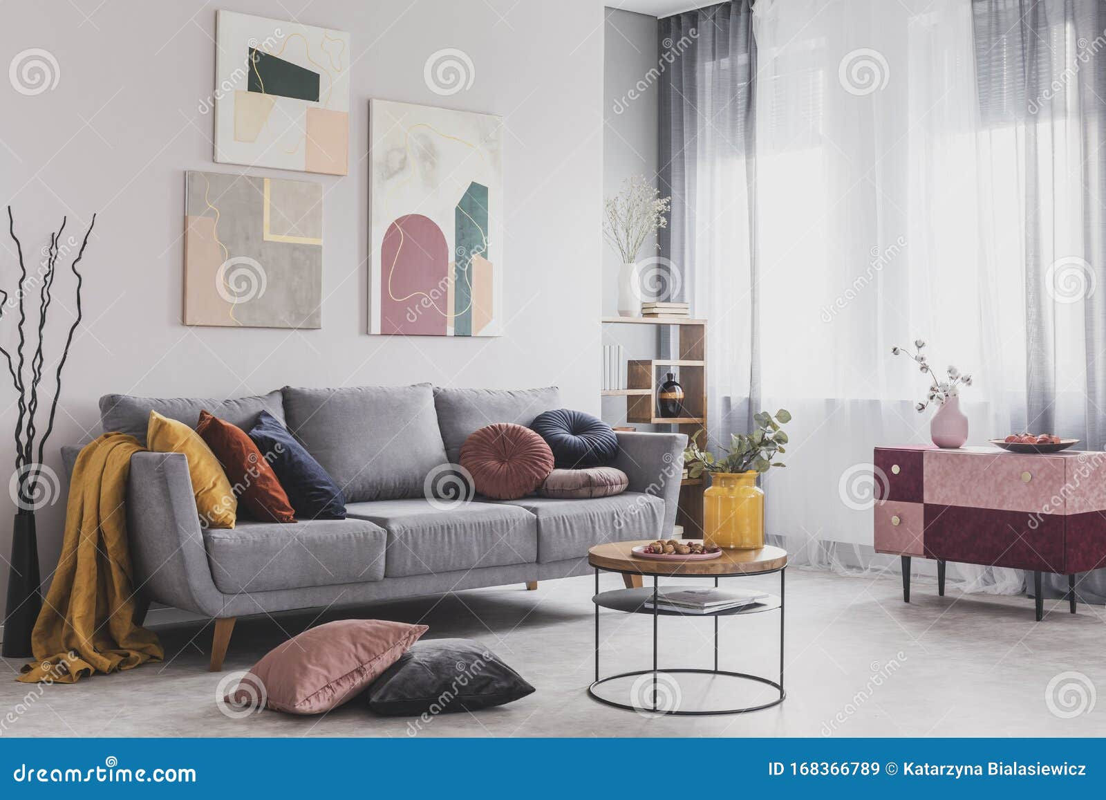 Wallpaper #dGfR85IBSpphPi3-E3ek252 Abstract Paintings Hanging on White Wall Above a Gray Sofa in a Living