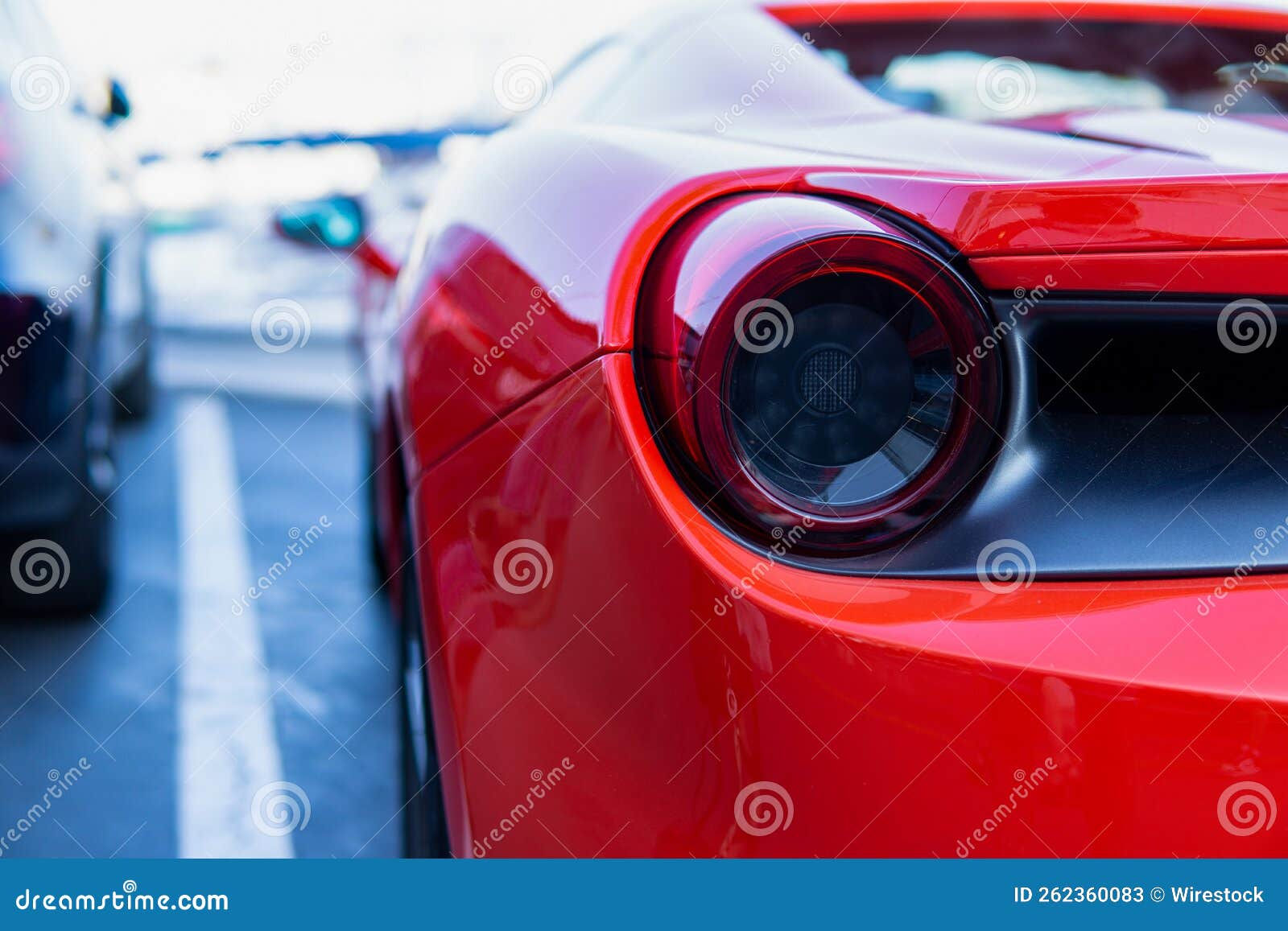 Wallpaper #gGeK55IBSpphPi3-Ajjr147 Rear View of a Red Modern Sport Car on City Beach Background Stock