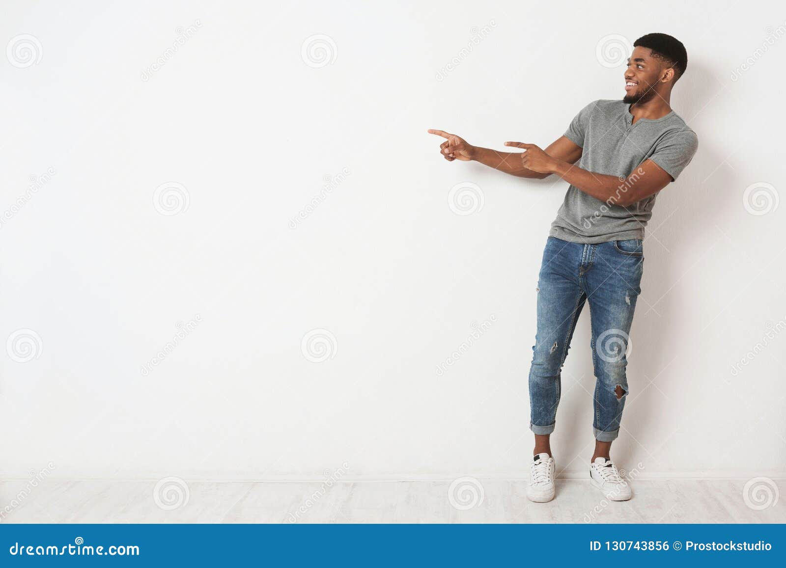 Wallpaper #IWf6_JIBSpphPi3-lZoB383 Excited Black Man Pointing Two Fingers Aside at Copy Space Stock Photo