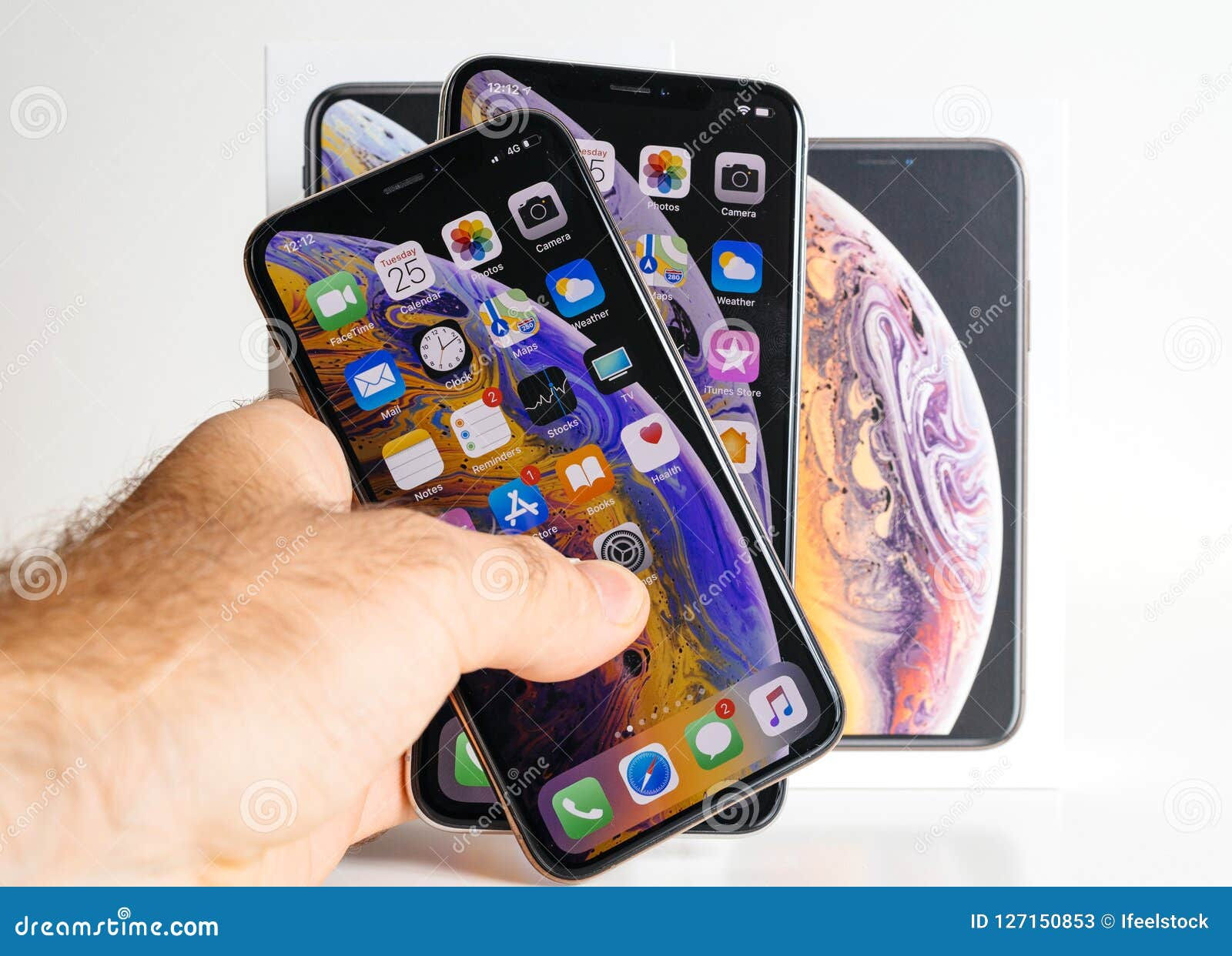 Wallpaper #vWds8ZIBSpphPi3-YWuR169 Apple iPhone Xs Max Gold Silver Smartphone in Mans Hand Editorial