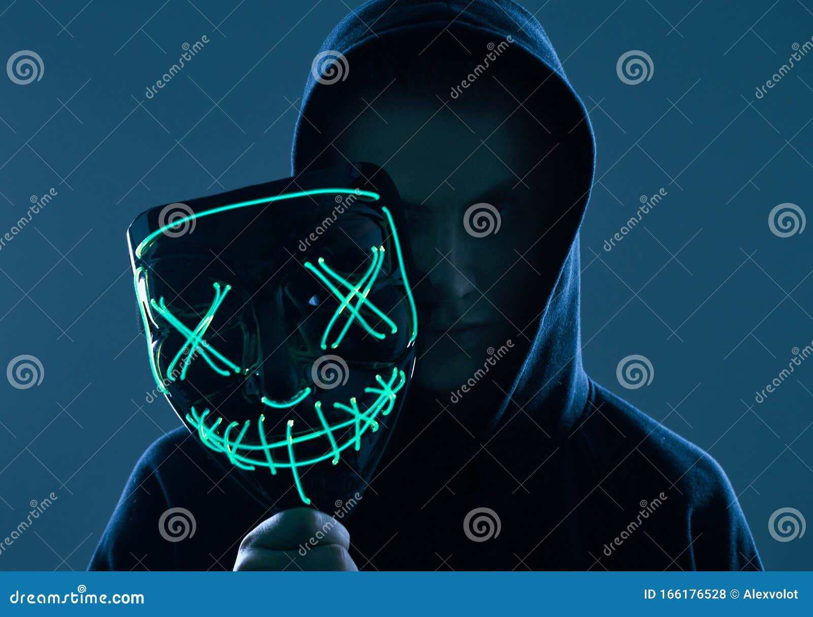 Wallpaper #vmfg95IBSpphPi3-Voeh140 Anonymous Man in Black Hoodie Hiding His Face Behind a Neon Mask Stock