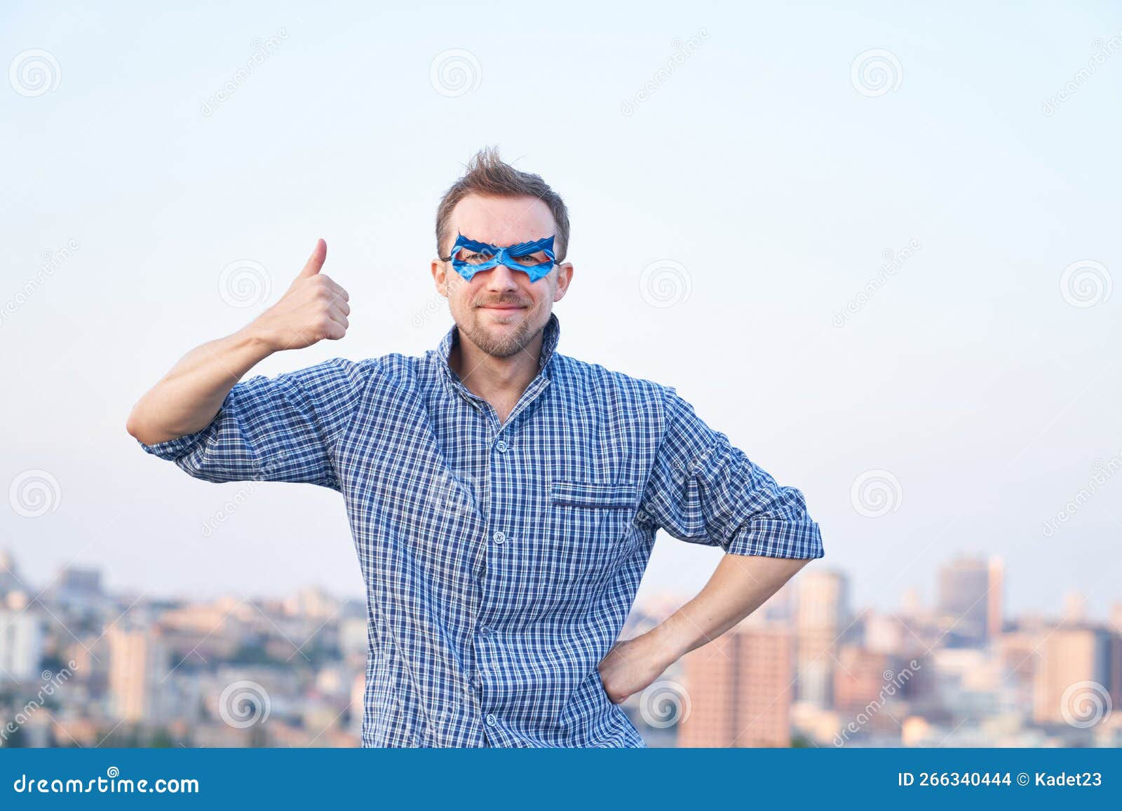 Wallpaper #m2fSBJMBSpphPi3-n7nR97 Cheerful Smiling Man in Blue Superhero Mask Shows Thumbs Up Gesture