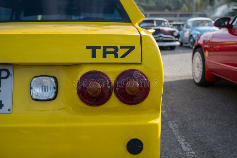 Wallpaper #O7n53ZIBJvJKYCmEmAPR123 Rear View of a Classic English Sports Car the Yellow Triumph Tr7