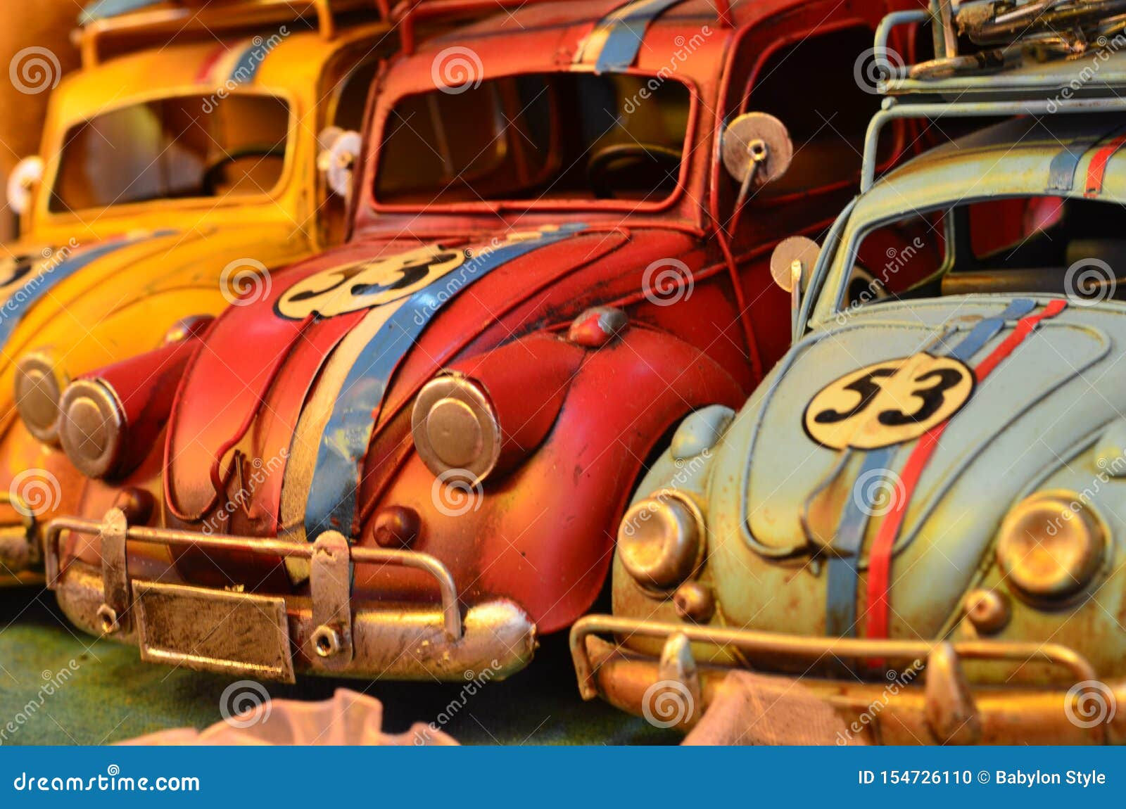 Wallpaper #JM_wOpMBOBUYluQY5LrR229 Three Decorative Handmade Colorful Cars Retro Old Car Editorial