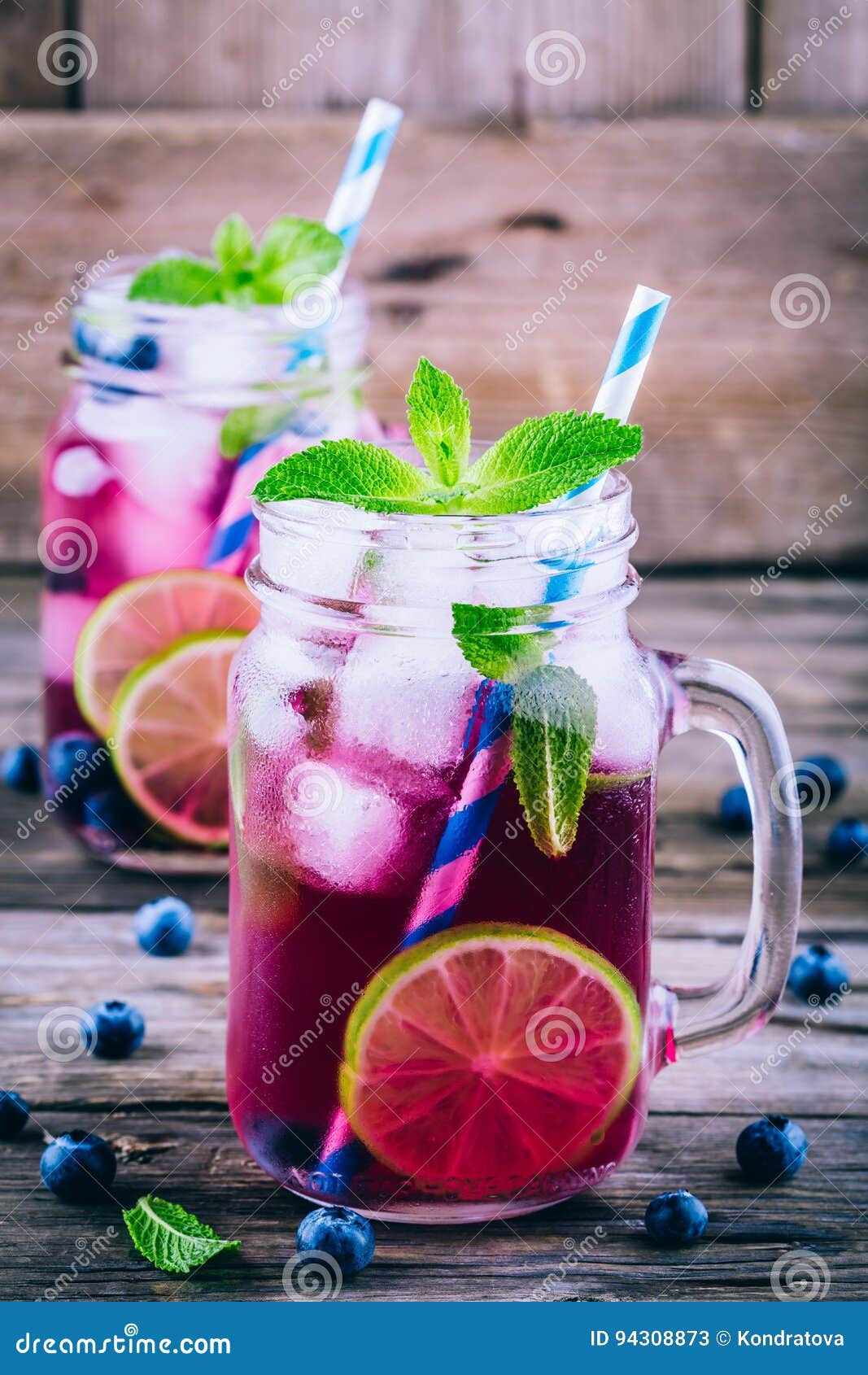 Wallpaper #4WcM6pIBSpphPi3-bkQ1230 Blueberry Ice Lemonade with Lime and Mint in Mason Jar Stock Image