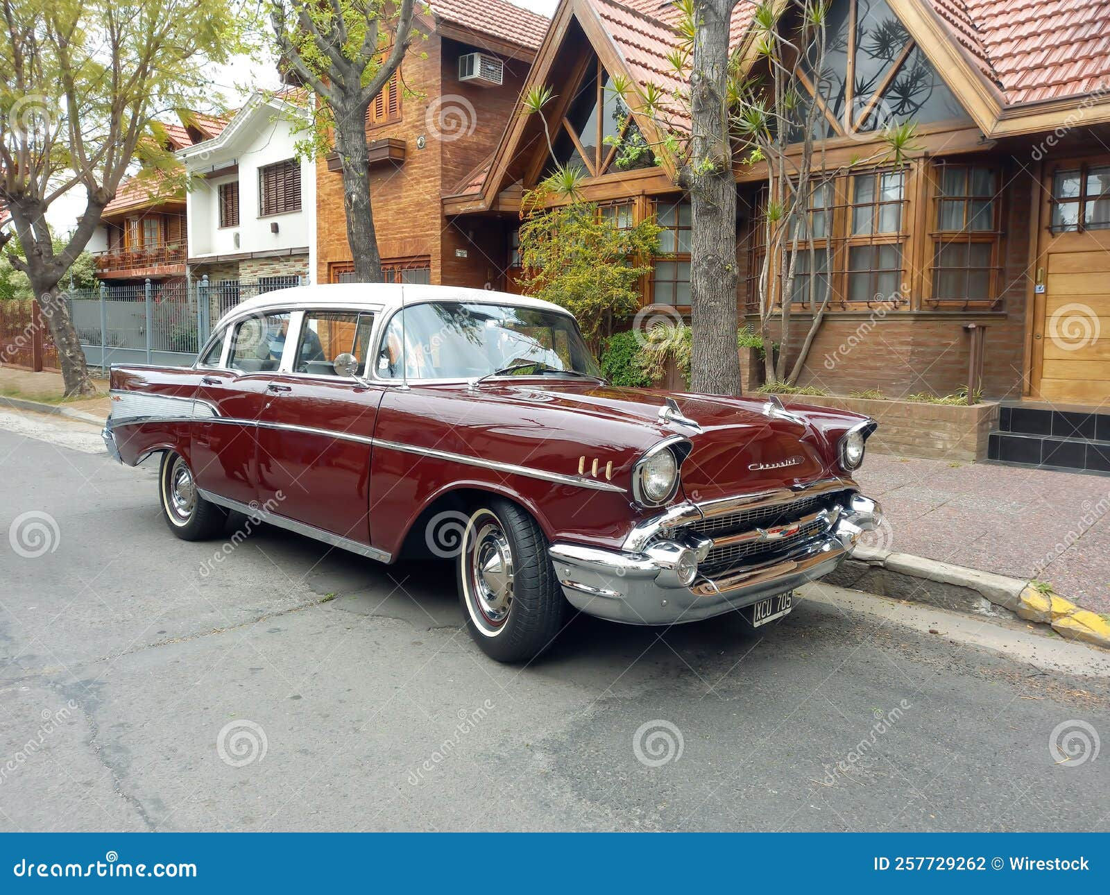 Wallpaper #c2c__JIBSpphPi3-x5fl215 Old Red 1957 Chevrolet Chevy Bel Air Sport Sedan Two Door Parked in the
