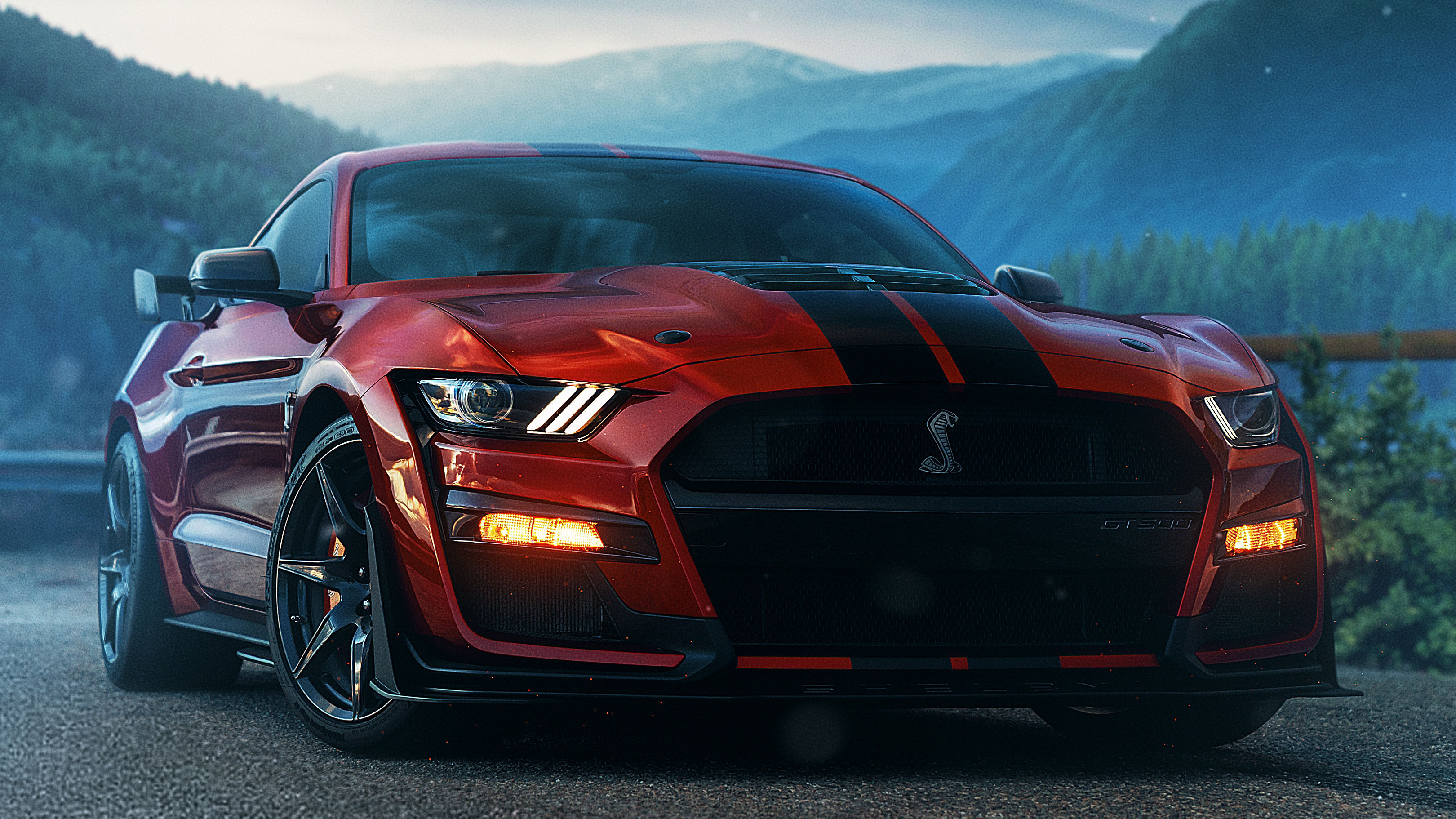 Wallpaper #nUUgl44B7YBJg1BVN6AP2 A Red Ford Mustang Shelby Gt500 Parked on a Foggy Road with Mountains in the Background