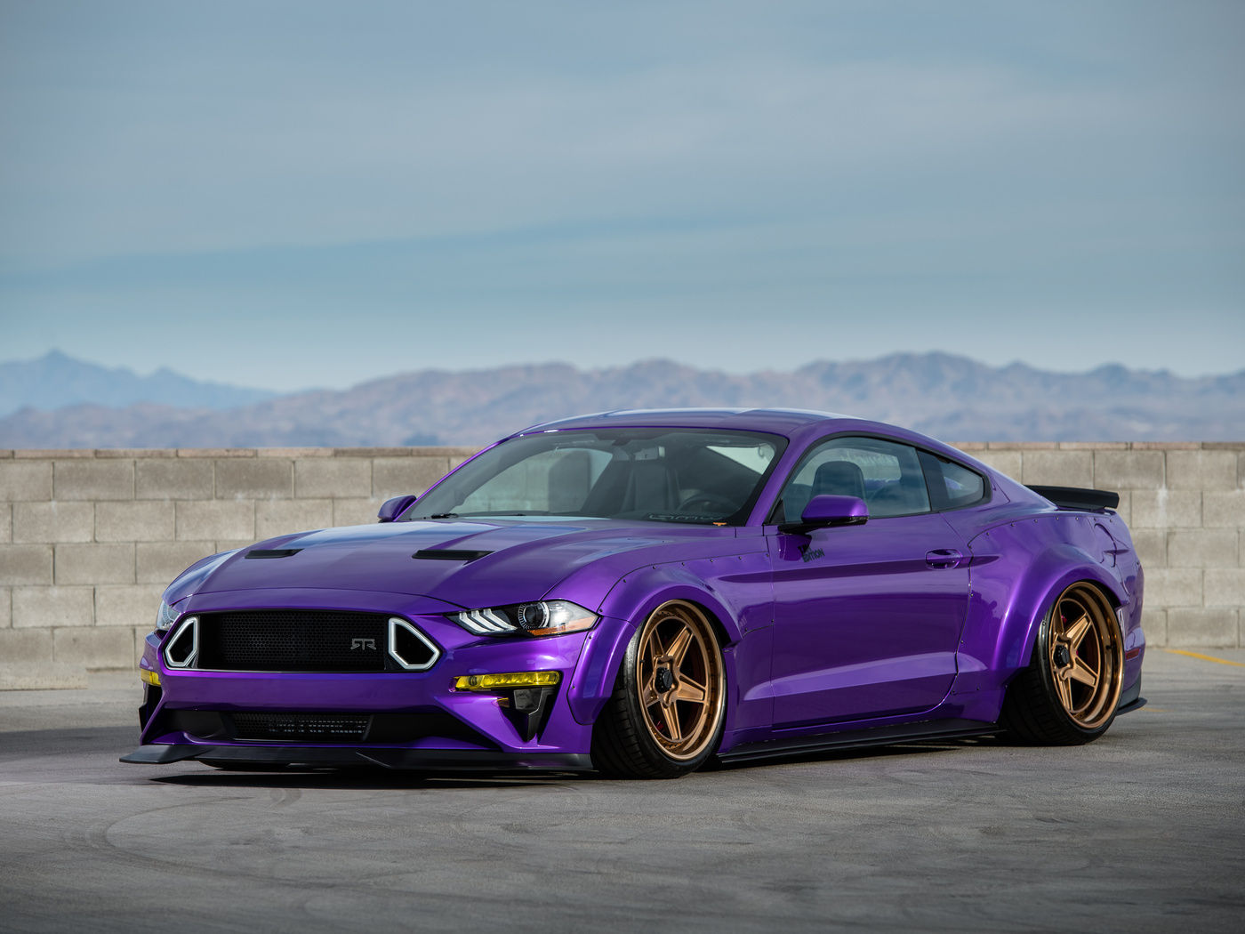 Wallpaper #_kWjoY4B7YBJg1BVvqN857 A Purple Ford Mustang with a Body Kit Parked on a Rooftop