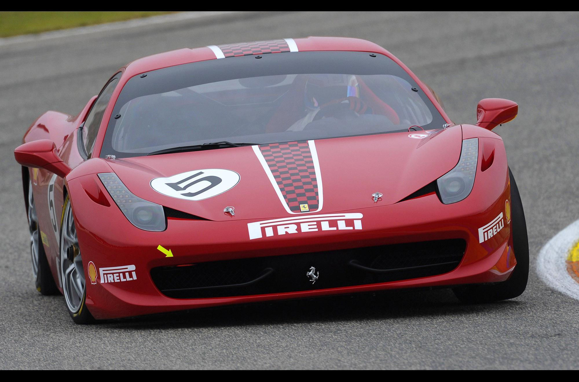 Wallpaper #53NJh44BFI5NbQkspCDD14 A Red Ferrari Race Car Speeds Down a Racetrack