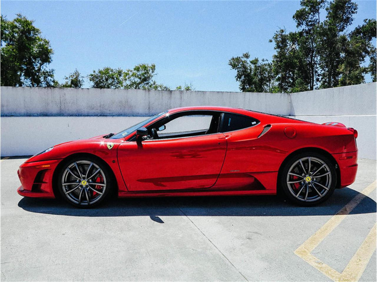 Wallpaper #inP_ho4BFI5NbQksZyB340 A Sleek Red Ferrari 458 Italia Parked in a Parking Lot