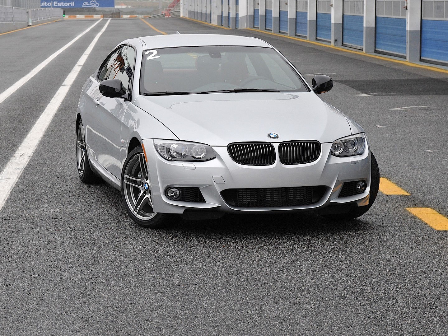Wallpaper #lUW_oo4B7YBJg1BVBqSA45 A Silver BMW 335i Coupe on a Race Track