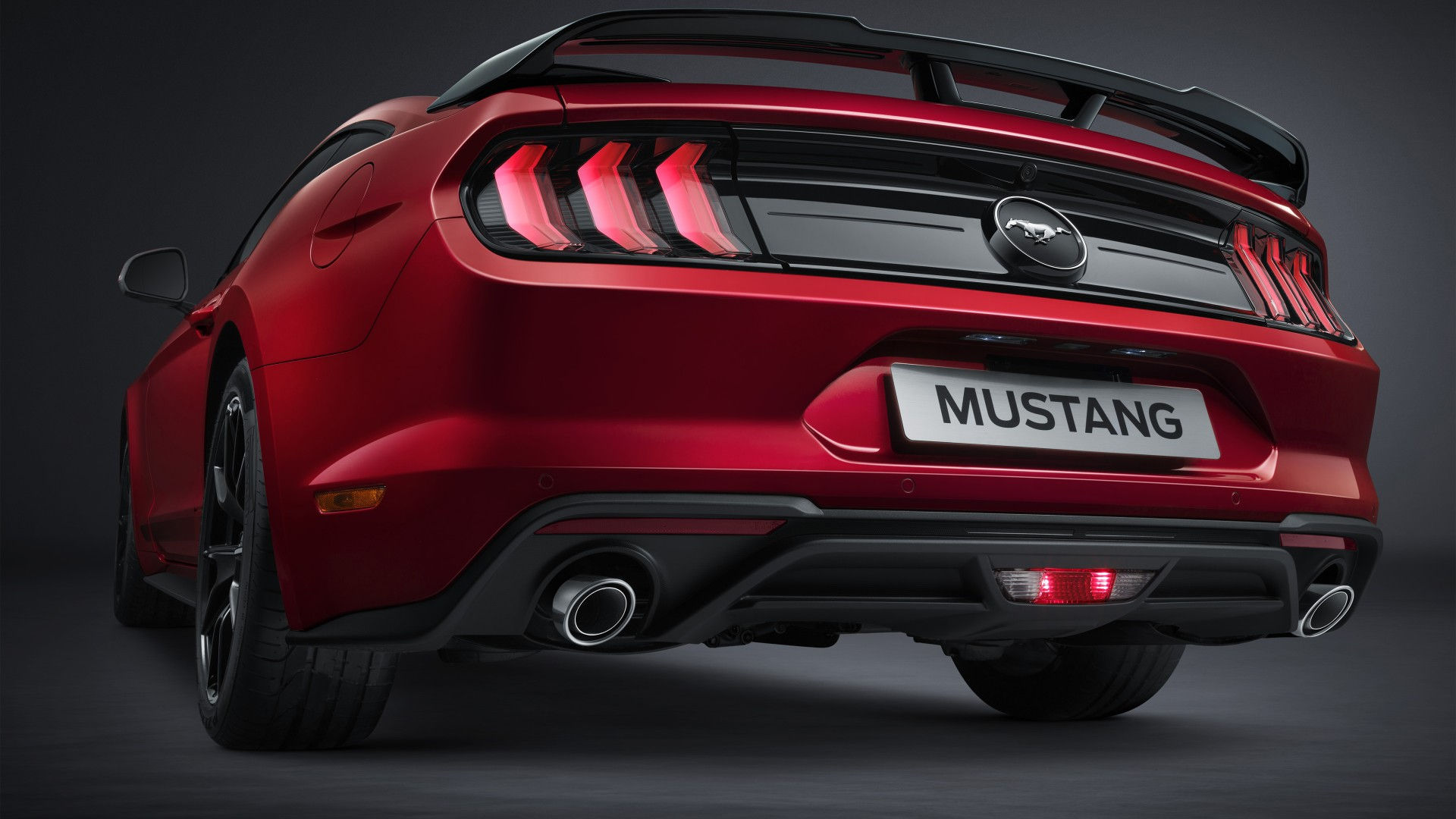 Wallpaper #_kWjoY4B7YBJg1BVvqN825 A Sleek Red Ford Mustang with a Spoiler