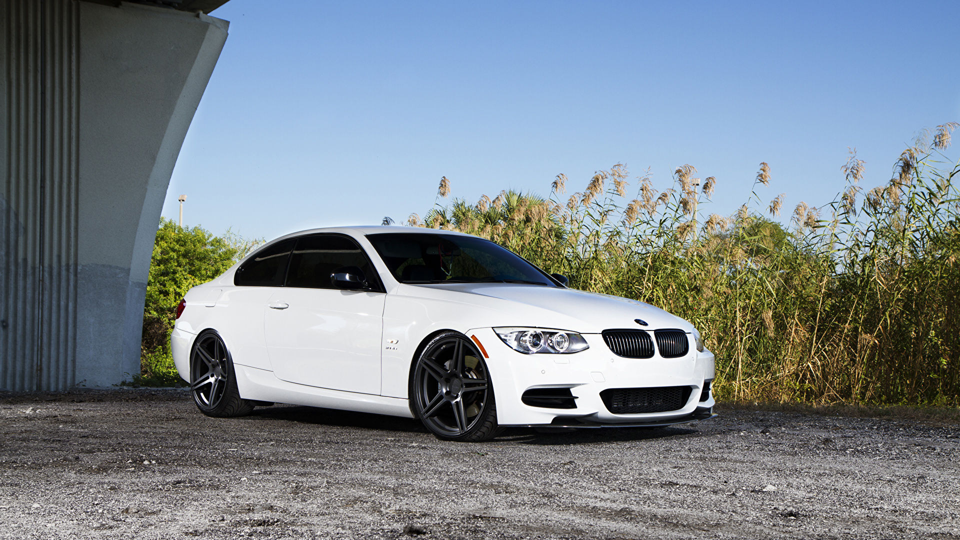 Wallpaper #9nMEgo4BFI5NbQksvxj_5 A Sleek White BMW Parked Next to a Grassy Field on a Sunny Day