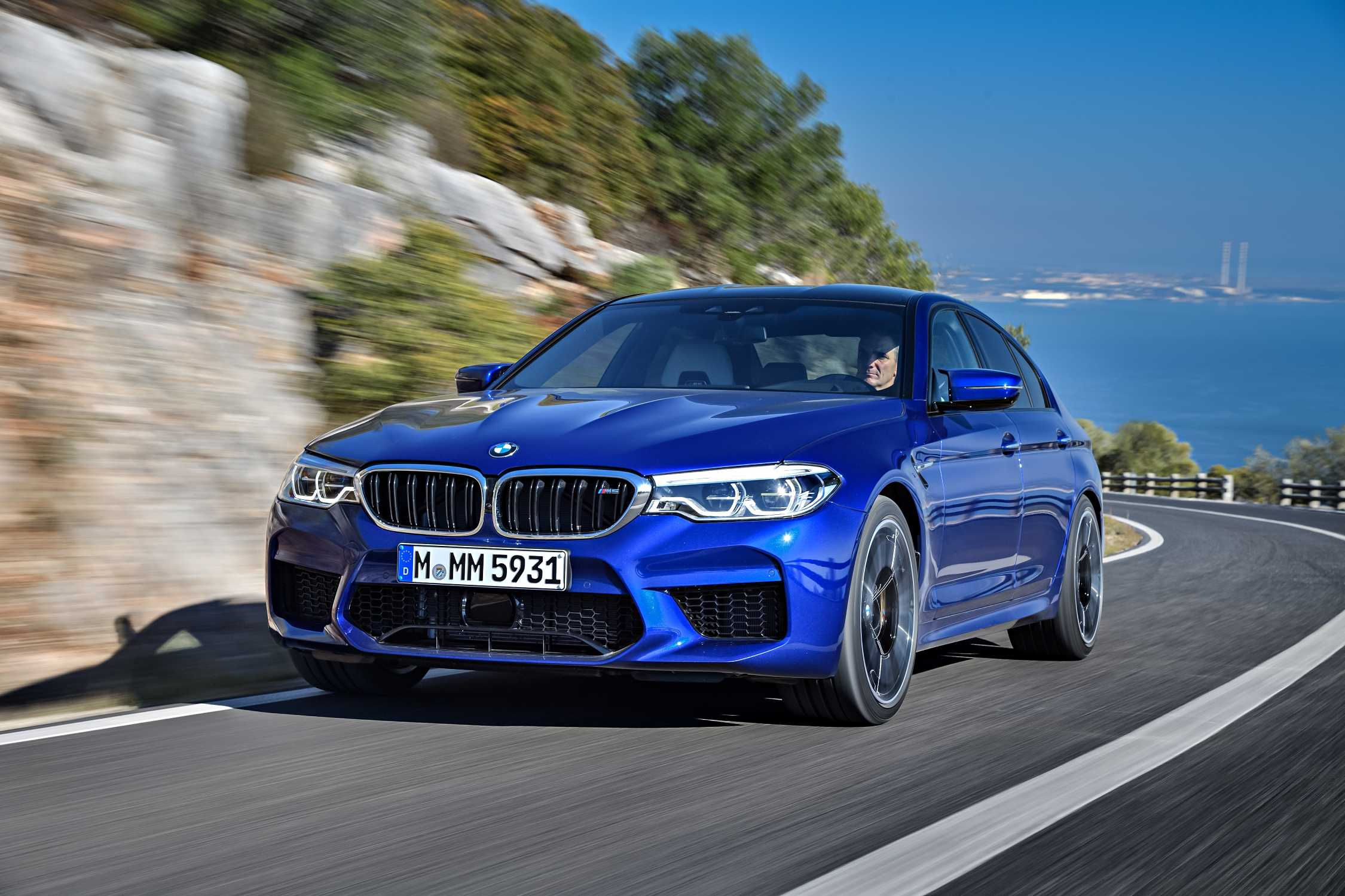 Wallpaper #5kWSl44B7YBJg1BVX6DR10 Blue  BMW  M5 Driving on Coastal Road