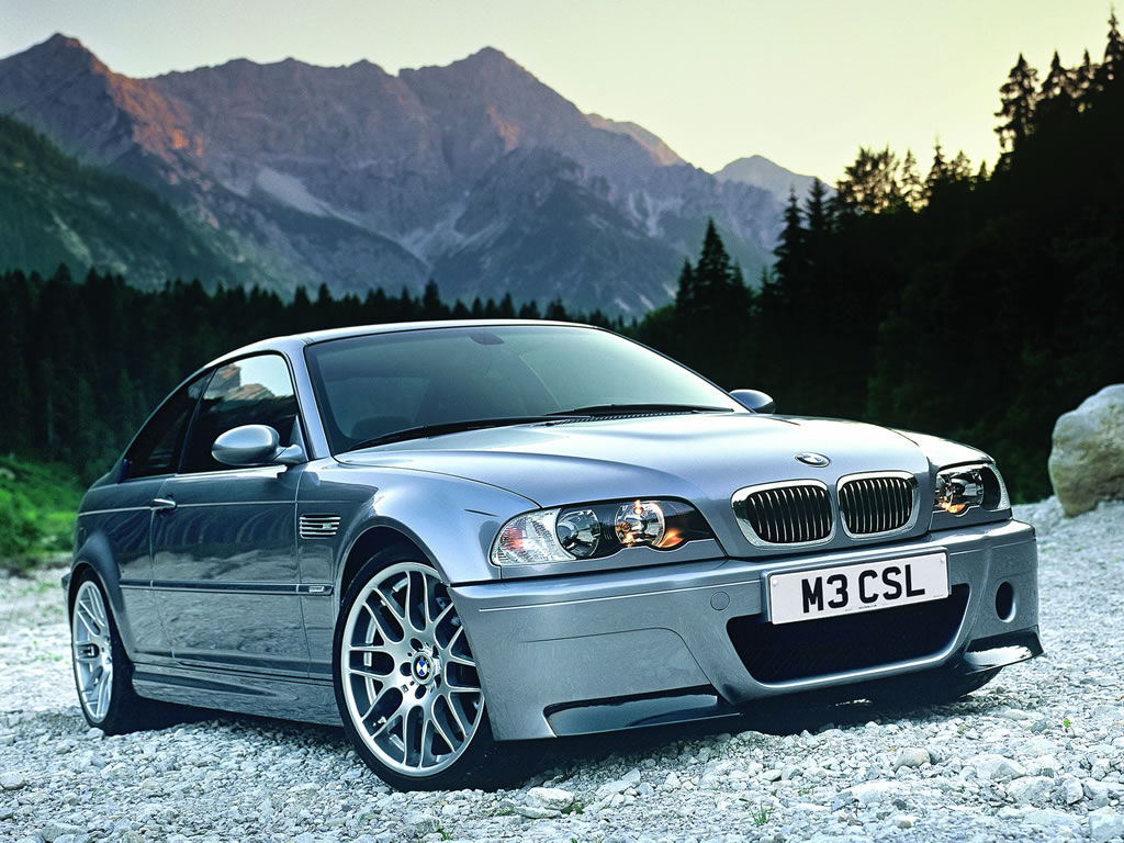 Wallpaper #w0Xoko4B7YBJg1BVD55I50 A Silver BMW M3 Csl Parked on a Mountain Road