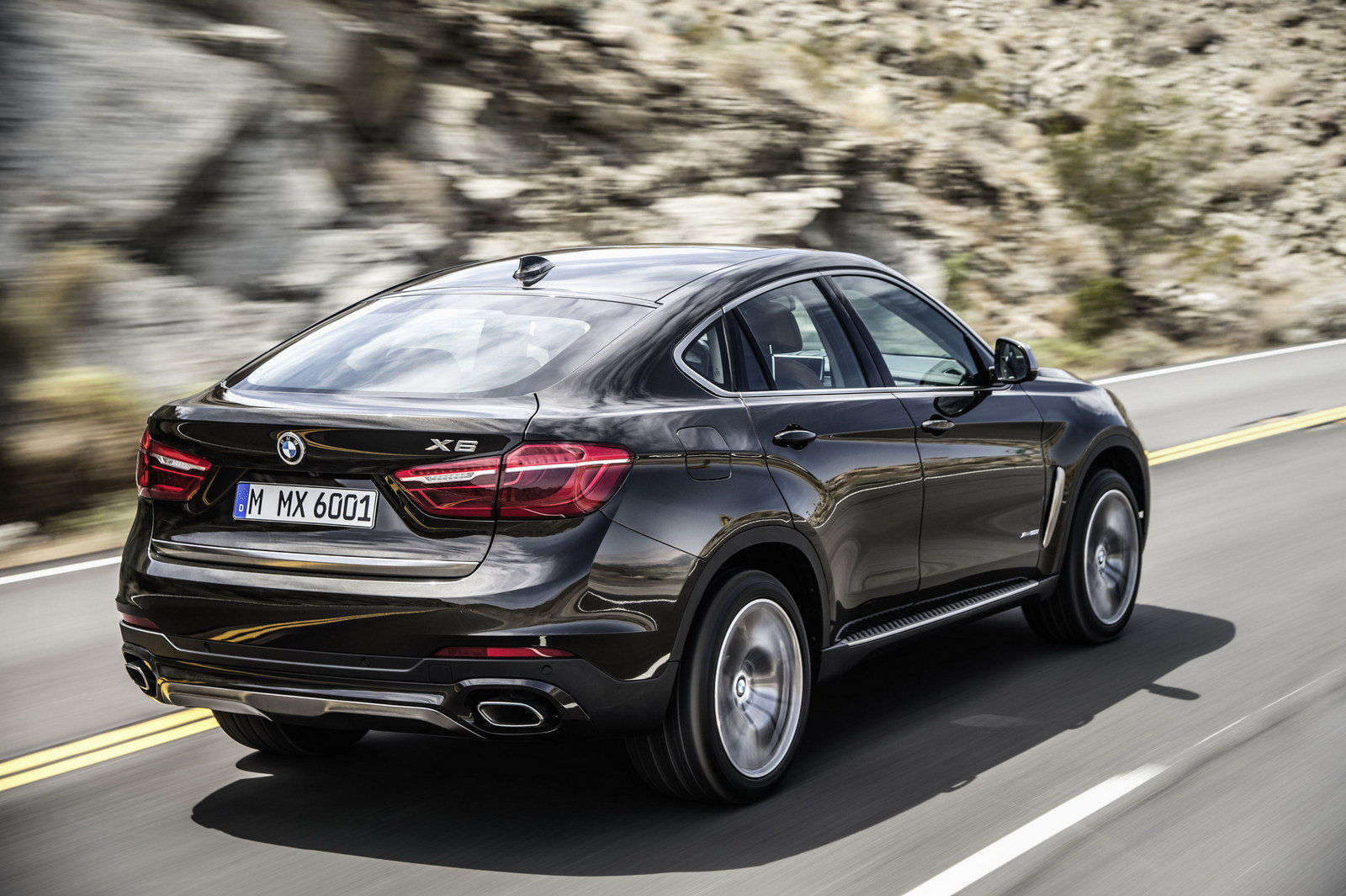 Wallpaper #uXP9h44BFI5NbQksAiHA1 The BMW X6 Driving on a Winding Road