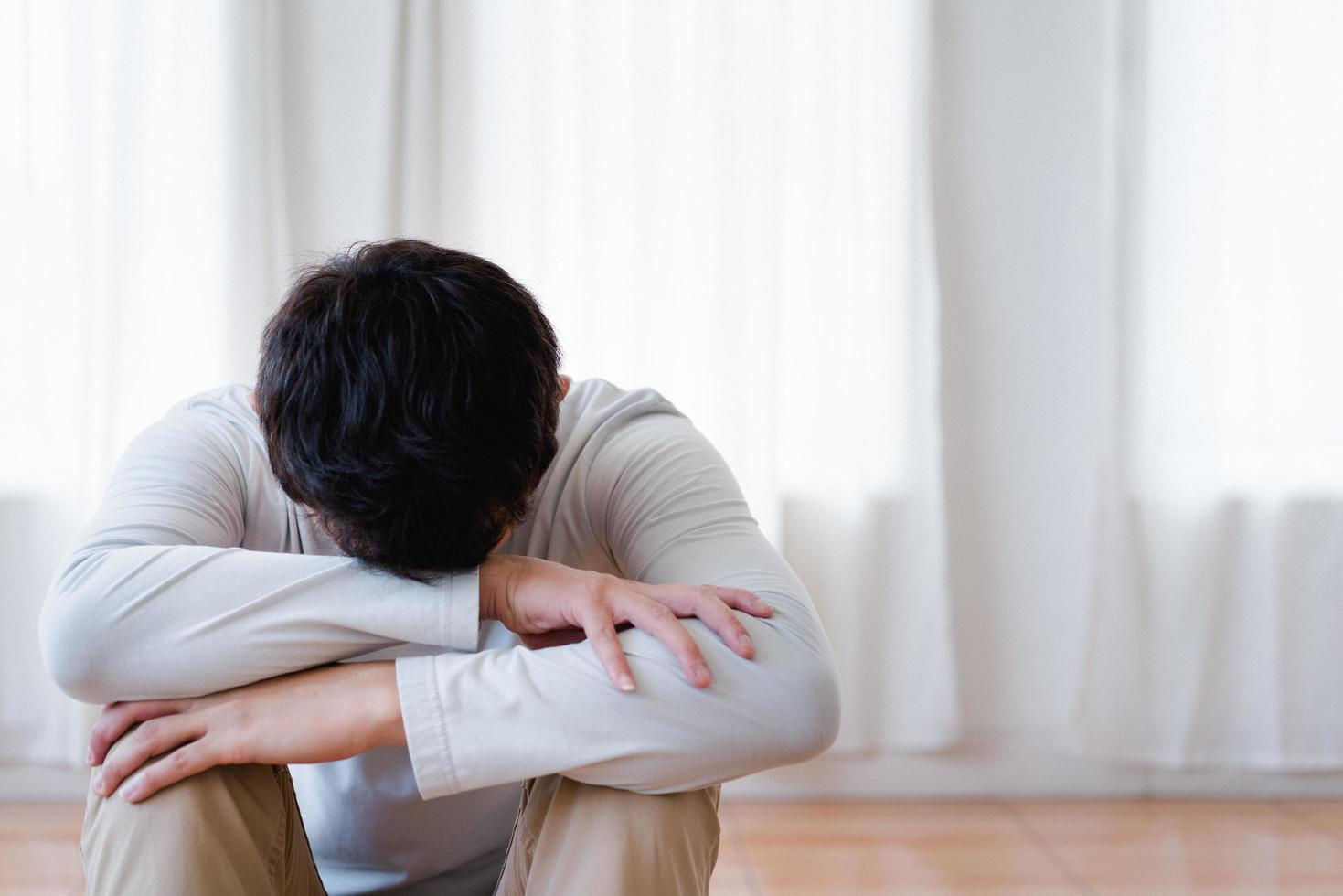 Wallpaper #q2eP65IBSpphPi3-00yX264 Depressed Asian Young Man Covering Face by Hands Crying Alone at Home