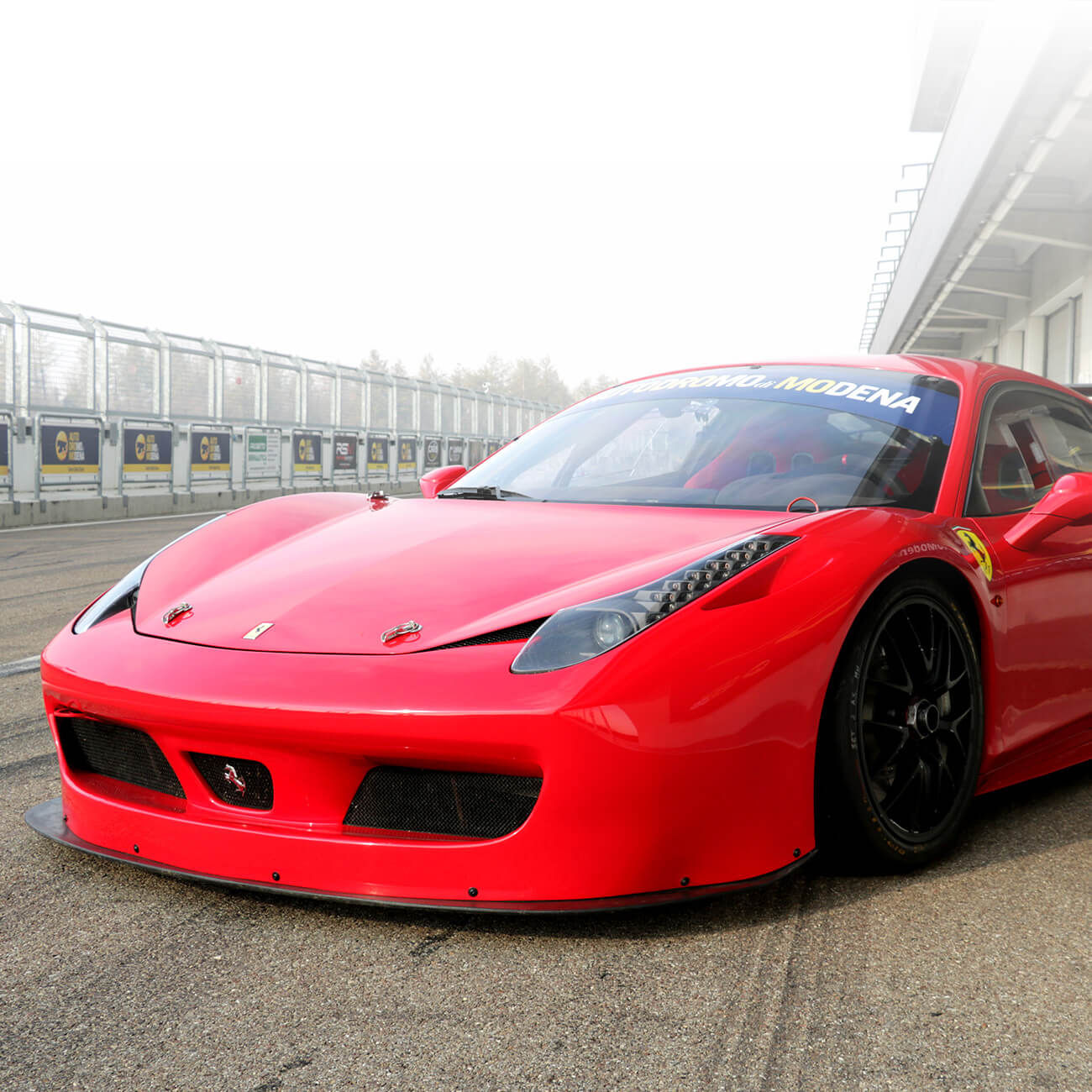 Wallpaper #53NJh44BFI5NbQkspCDD36 Red Ferrari Race Car on a Race Track