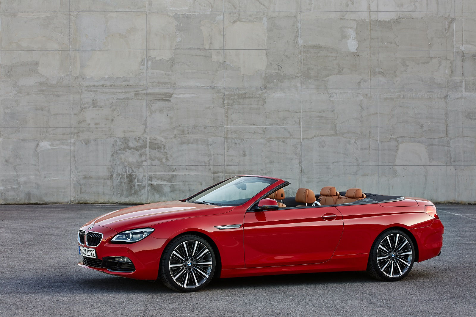 Wallpaper #VkVolo4B7YBJg1BVLqAC48 A Red BMW 6 Series Convertible Parked in Front of a Concrete Wall