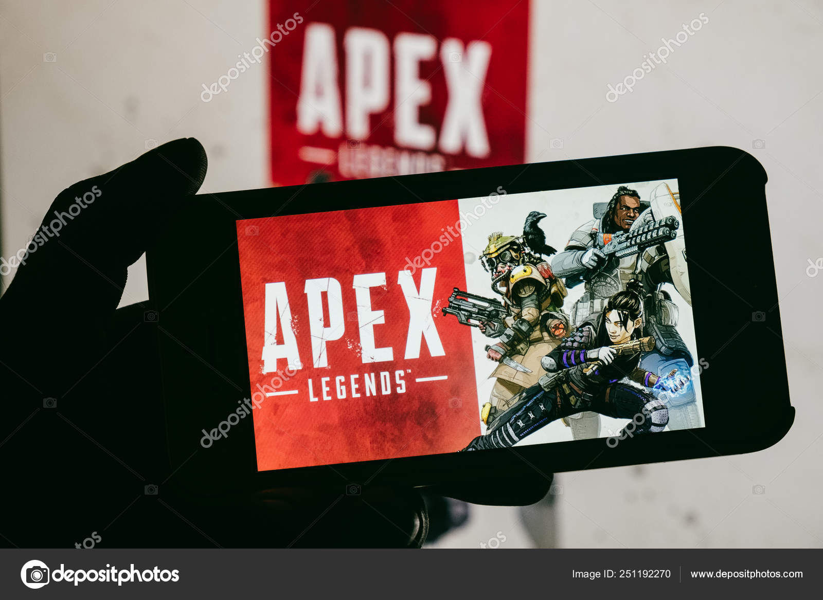 Wallpaper #bz-rO5MBLiIJ4c9OFY8C42 Apex Legends Logo Displayed Mobile Phone Hold Young Boy Who Stock